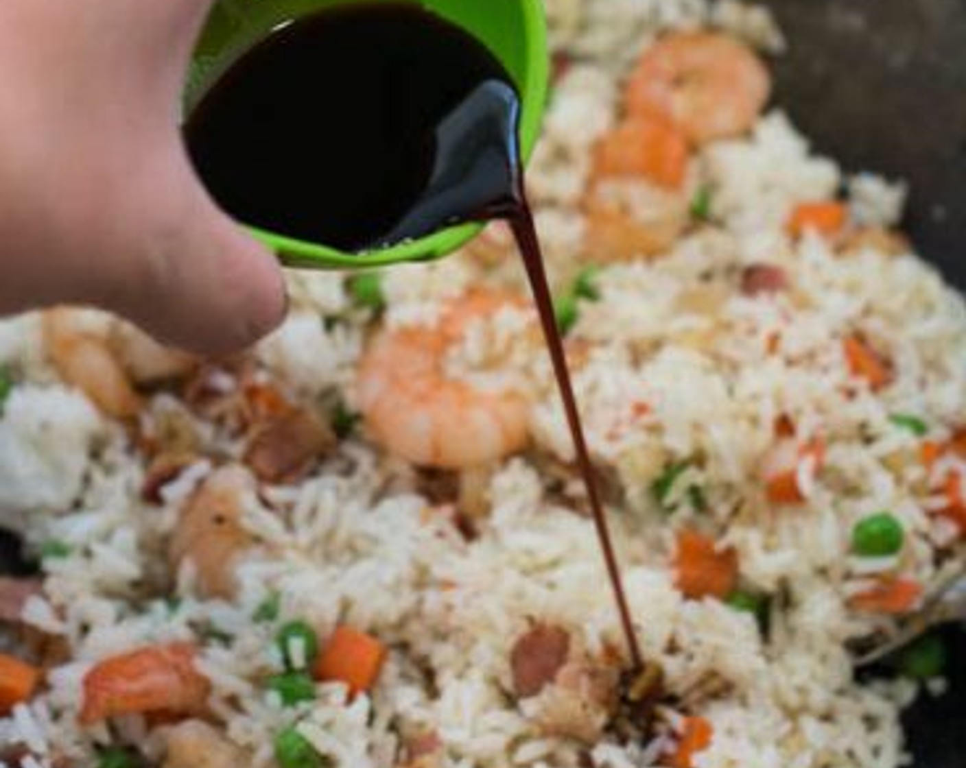 step 7 Add the cooked White Rice (1 1/3 cups) to the wok, then stir to combine all ingredients. Drizzle the Soy Sauce (1/2 Tbsp) over the rice. Give everything a good stir to season all of the rice. Do a quick taste test; add more soy sauce or salt to your taste if needed.