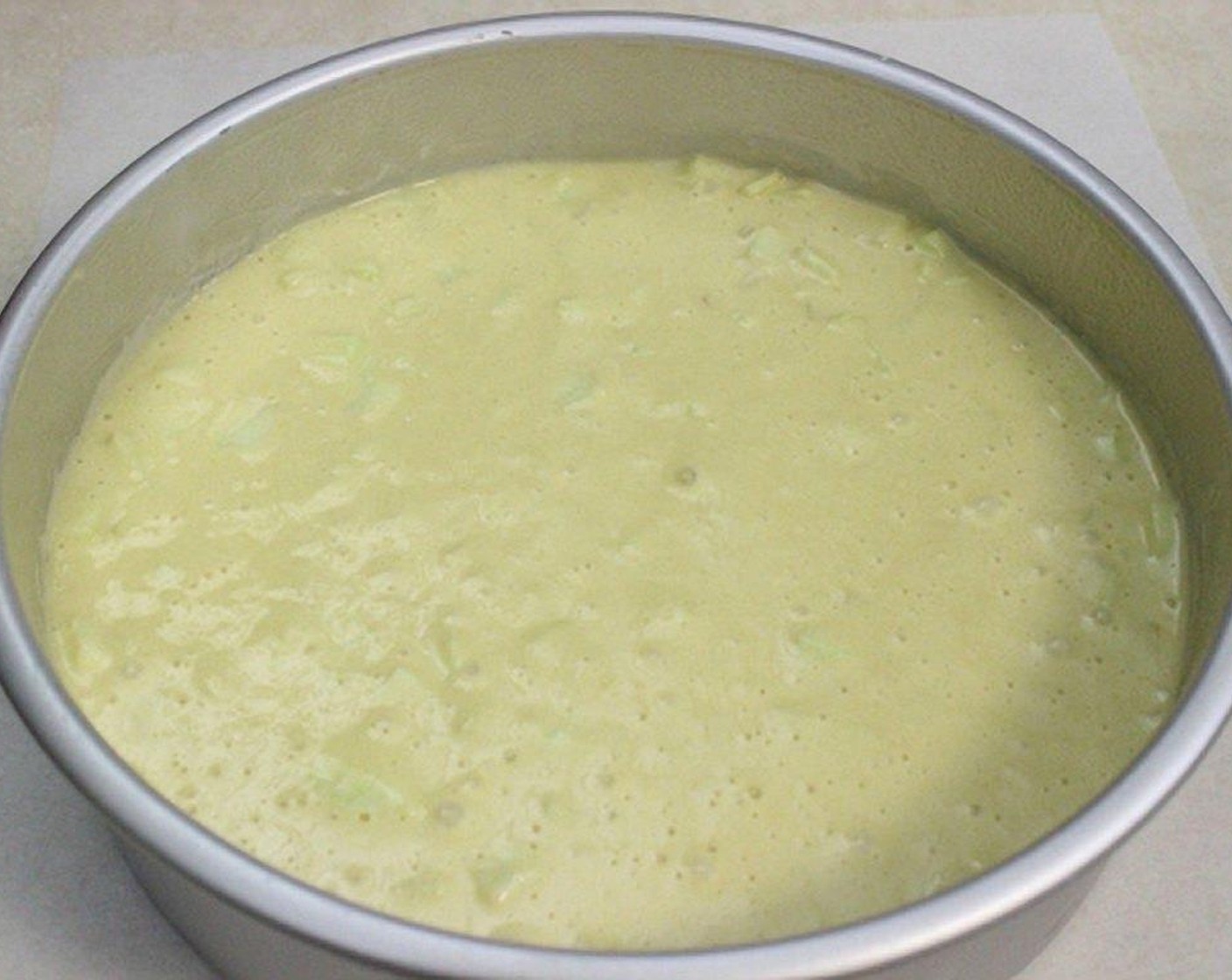 step 8 Distribute the batter evenly over the apples.