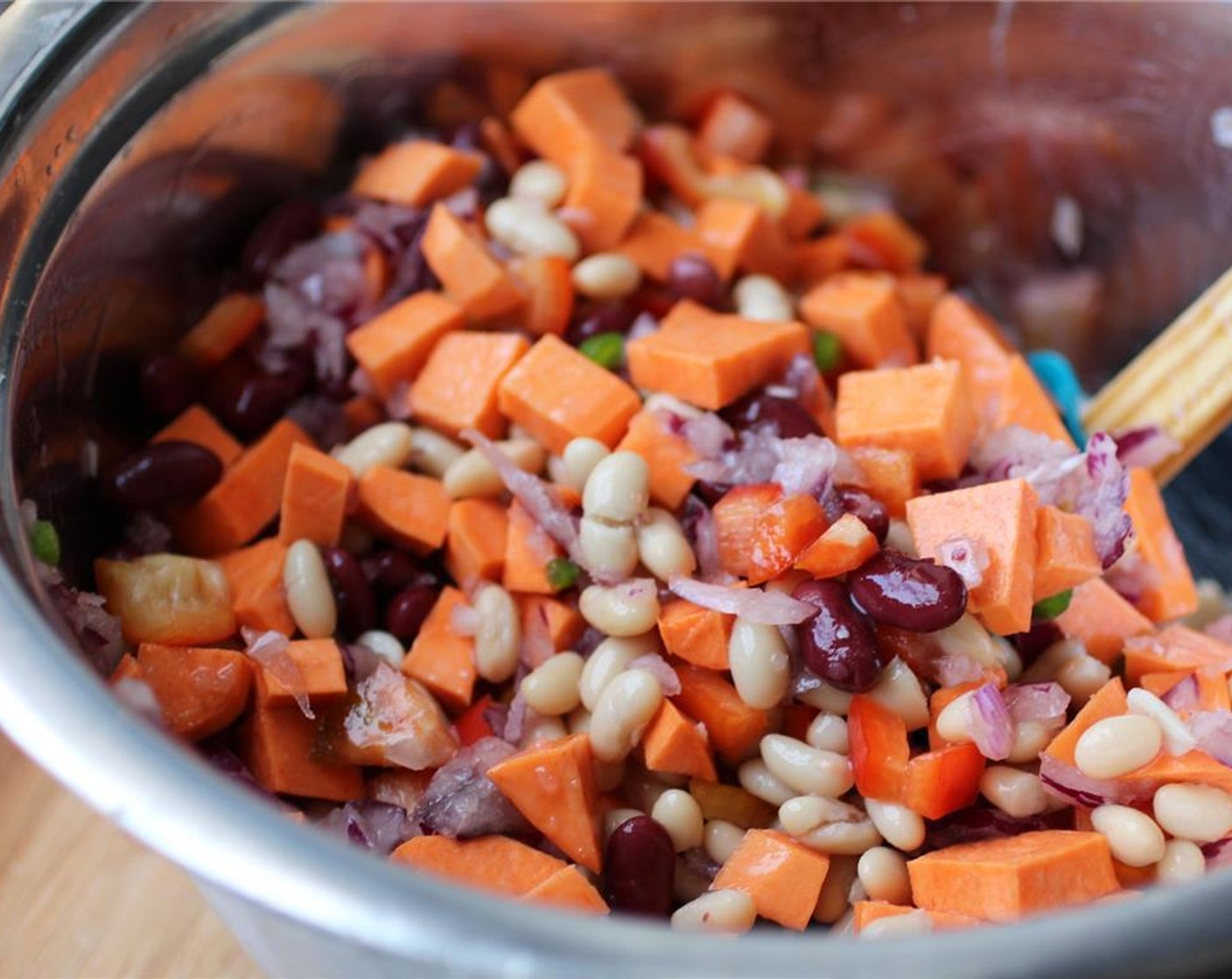 step 2 Add the Red Kidney Beans (1 can), Great Northern Beans (1 can), Fire Roasted Diced Tomatoes (2 cans), Water (1 can), Liquid Smoke (1 Tbsp), Ground Cumin (1 Tbsp), Chili Powder (1 Tbsp), Salt (1 tsp), and Ground Black Pepper (1 tsp). Stir well.