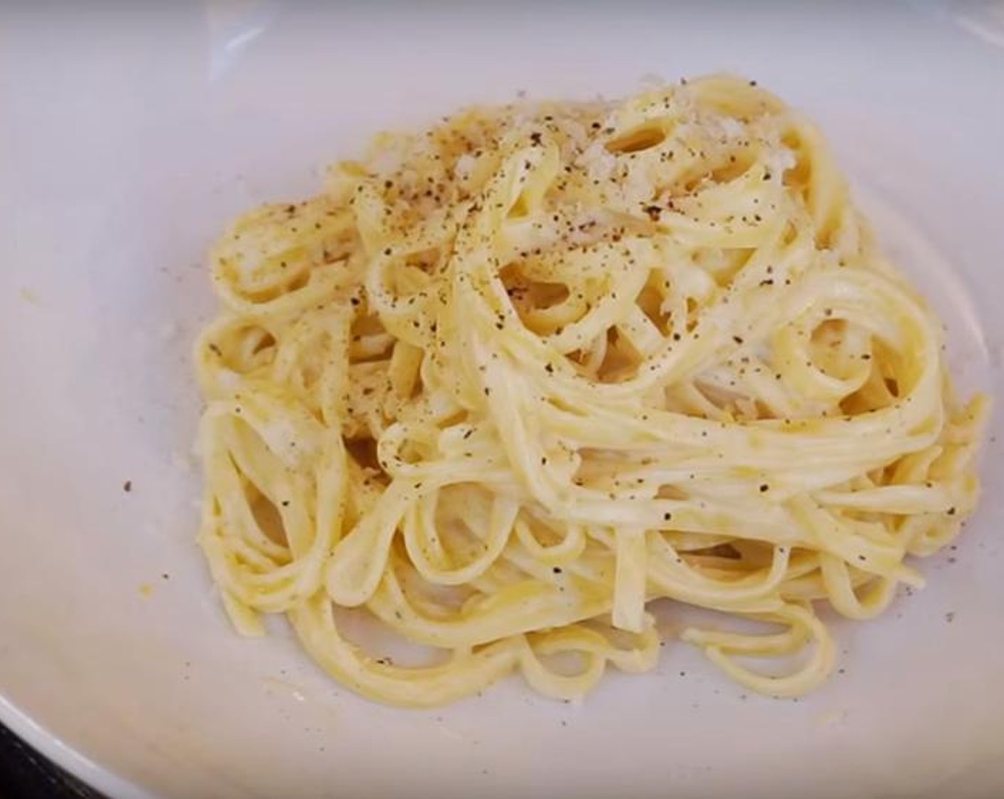 step 2 In a saucepan over medium heat, add Butter (1/3 cup), Cream (1/2 cup), Lemons (2), Salt (to taste). and Ground Black Pepper (to taste), and stir together until the butter is melted. Turn off the heat and add pasta, toss together, and stir in one-fourth of a cup or so of the starchy cooking water. Add Parmesan Cheese (to taste) and serve.