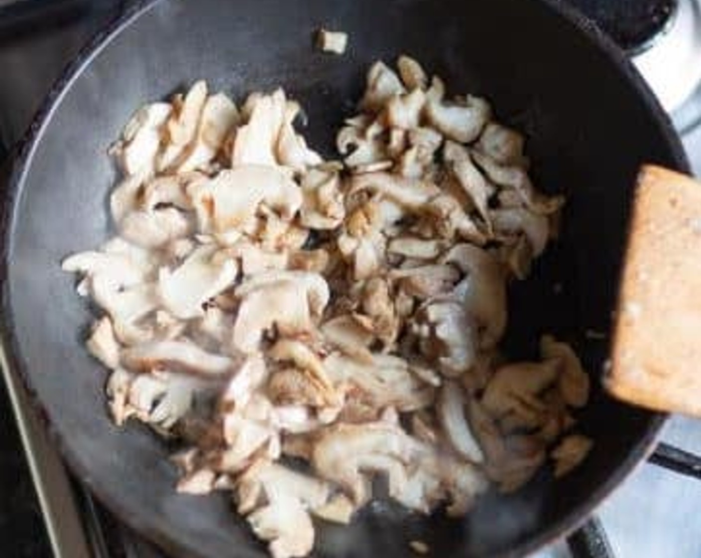 step 2 Add Mushrooms (2 cups) and Fresh Thyme Leaves (2 sprigs), stir-fry on medium heat for 4-5 minutes.
