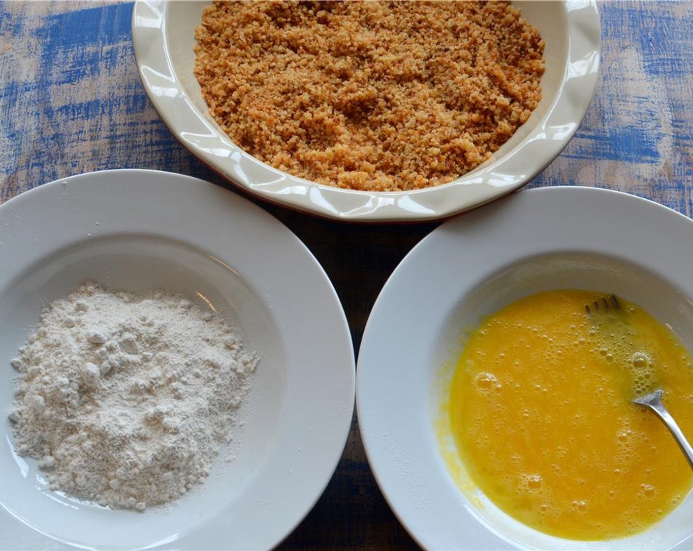 step 9 In 3 separate plates big enough for the chicken breasts, beat large Eggs (2) in one. In another, mix together All-Purpose Flour (1 cup) and salt with a fork. In the final bowl, add the bread crumbs.