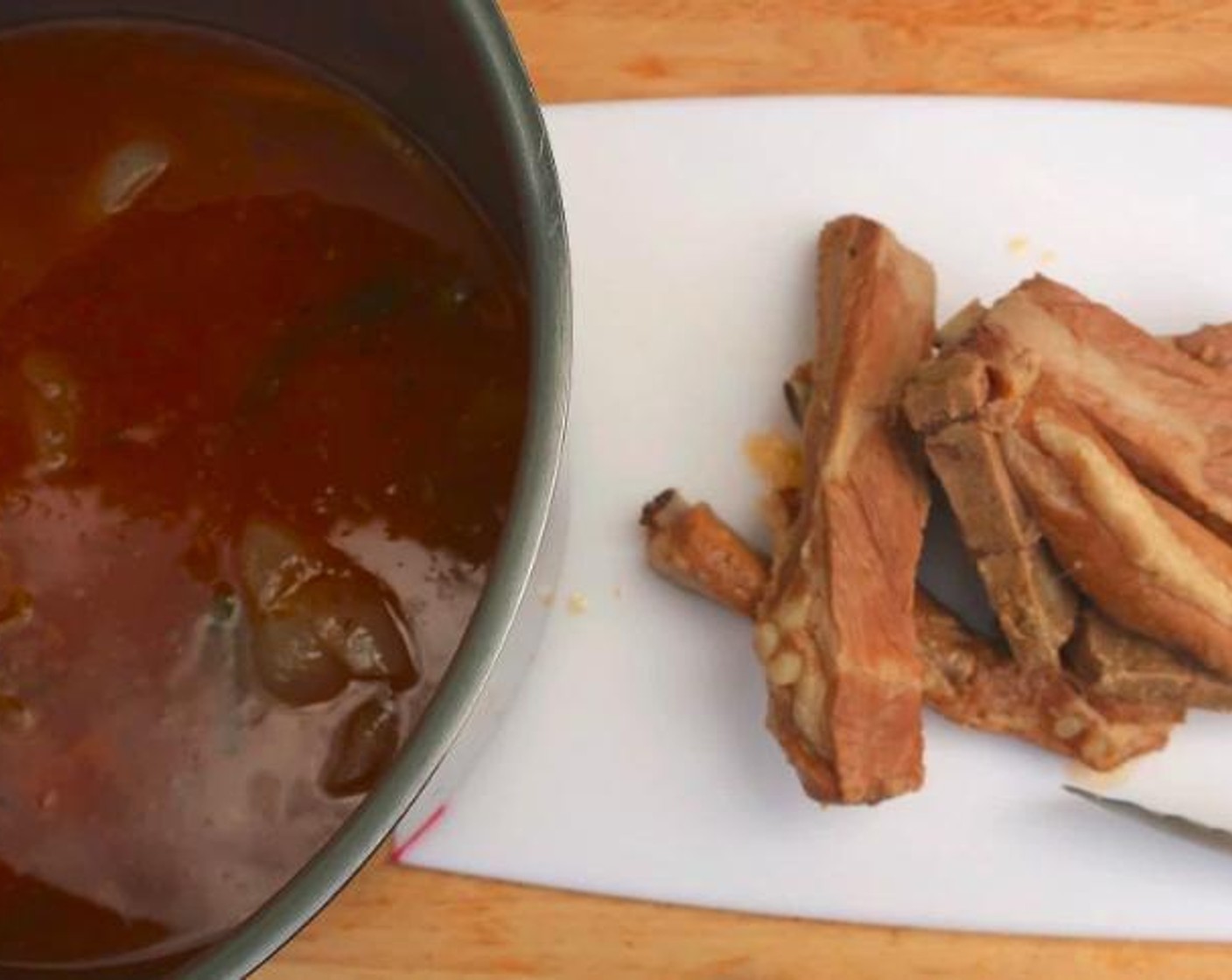 step 3 Remove pork to a cutting board, remove and discard bones, cut into bite-size pieces.