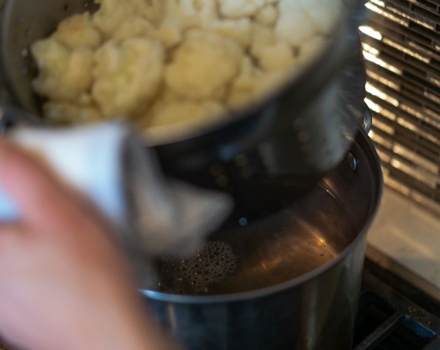 step 3 Drain the cauliflower thoroughly. Place the cauliflower in the food processor.