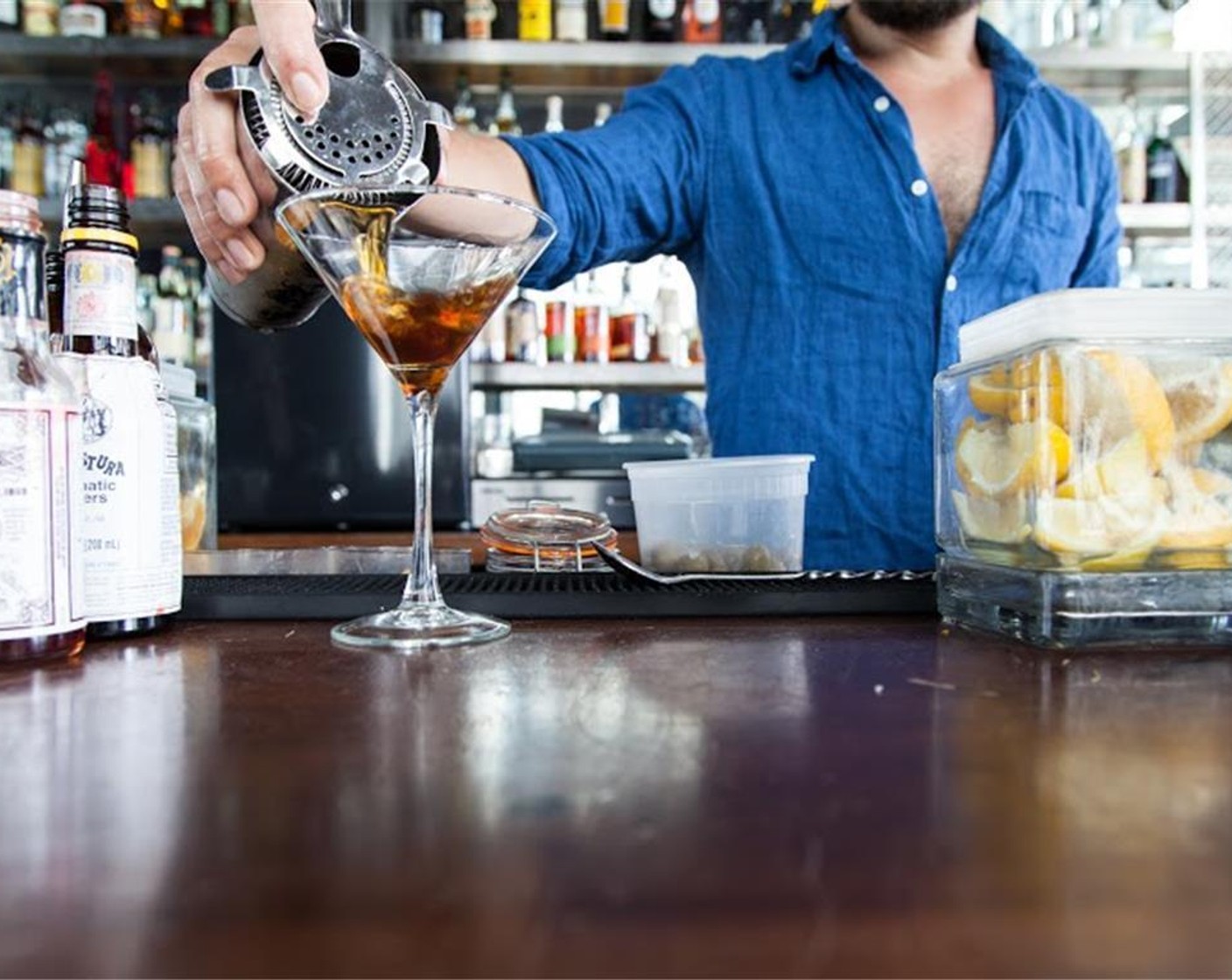 step 1 In a mixing glass, mix Rye Whiskey (4 Tbsp), Sweet Vermouth (2 Tbsp), Angostura Bitters (3 dashes), and Ice (to taste). Strain into a martini glass. Garnish with Brandied Cherries (to taste).
