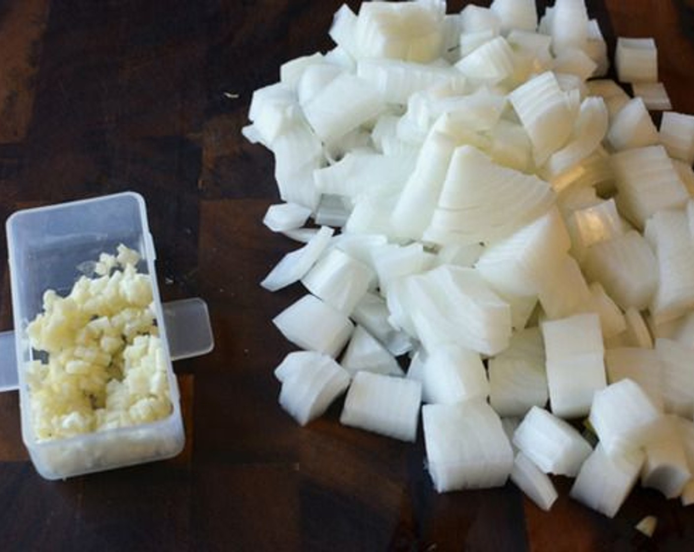 step 1 Roughly dice the Onion (1) and mince the Garlic (4 cloves).