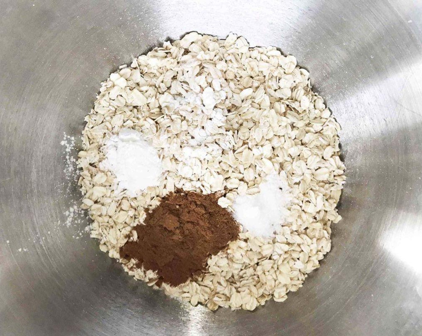 step 2 In a medium-size bowl, mix together the Old Fashioned Rolled Oats (2 cups), Baking Powder (1 tsp), Ground Cinnamon (1/2 Tbsp), and Sea Salt (1/2 tsp). Set aside as well.