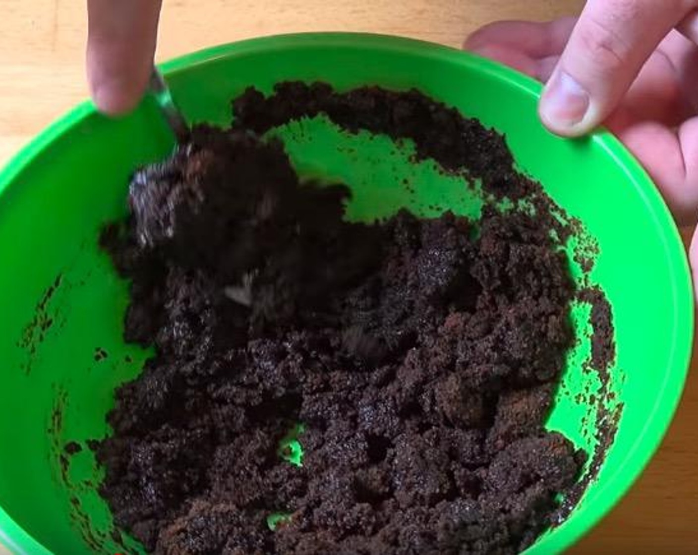 step 1 In a large mixing bowl, add Chocolate Cookies (9 oz) and Butter (3.5 oz). Stir together until mixture has the texture of wet sand.