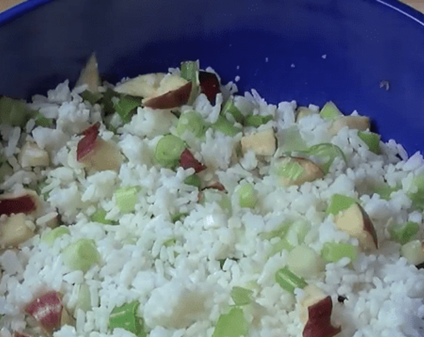 step 3 Get the cookedWhite Rice (1 1/3 cups) in a big bowl. Add in Celery (1 stalk) and Scallion (1 bunch), In order to add a bit color and some sweetness, chop up Red Apple (1) and dust that up. Toss them together.