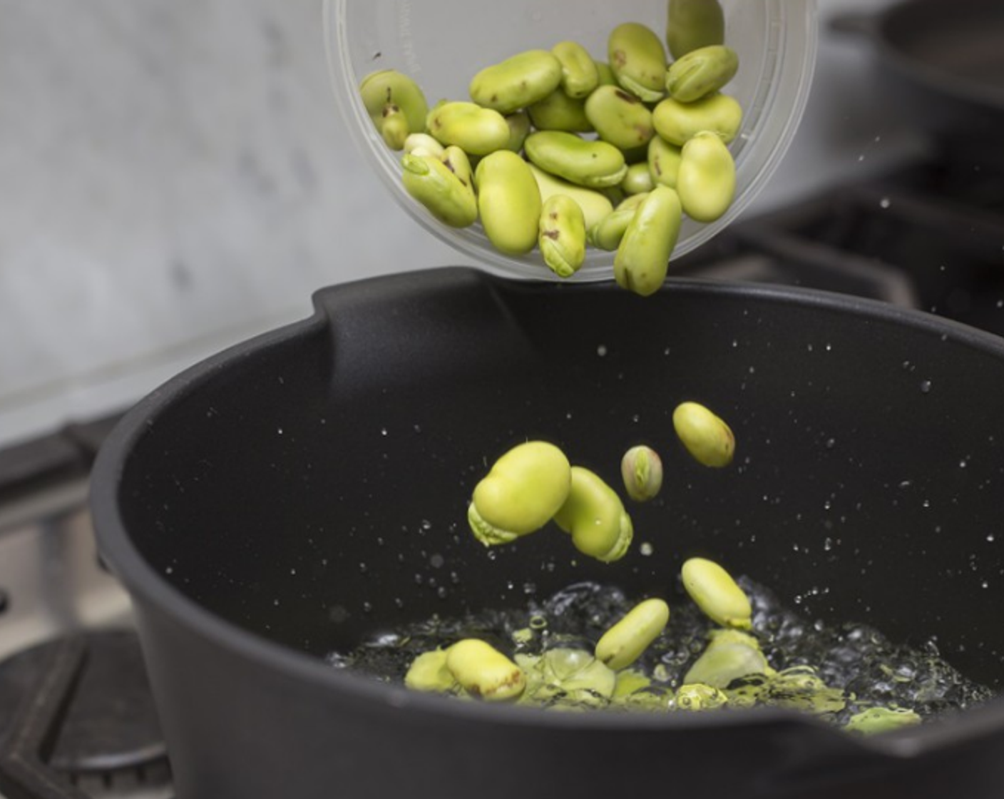 step 5 Add fava beans to the boiling water and cook until they are soft, 2­3 minutes - the bean should taste sweet, not starchy. Remove beans with a slotted spoon and drop immediately in the ice water to stop the cooking; stir and let rest a few minutes.
