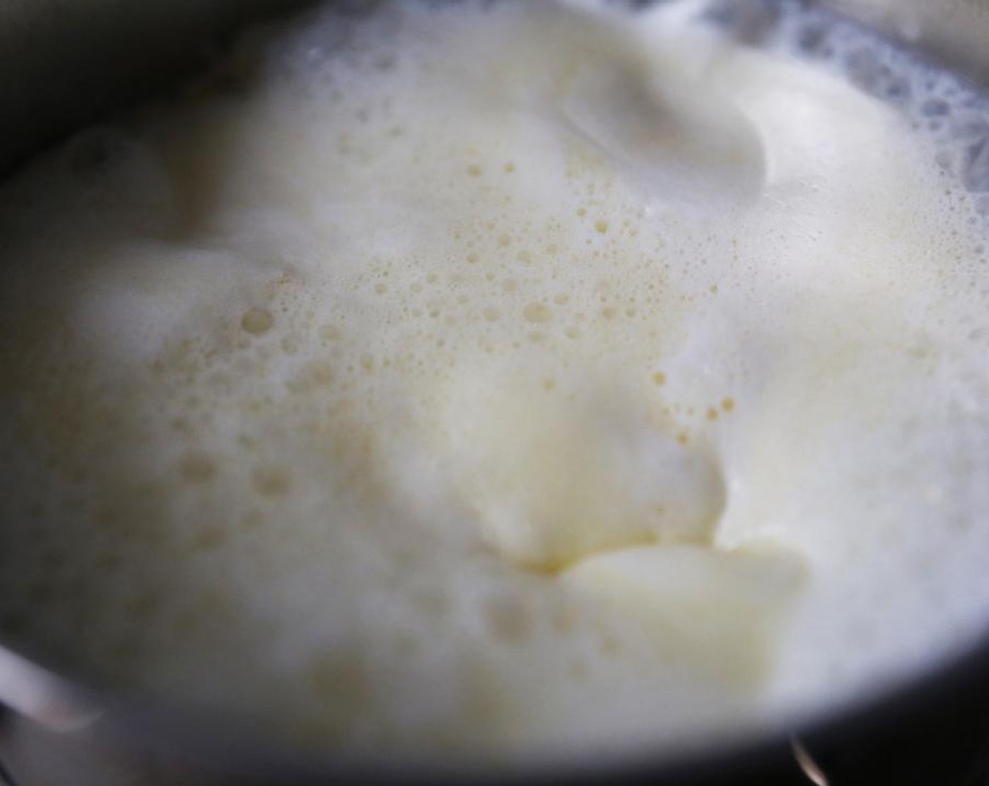 step 4 Combine the  Butter (1/2 cup) and Milk (1 cup) in a saucepan and melt the butter over low heat. Bring to a boil, then remove from the heat.