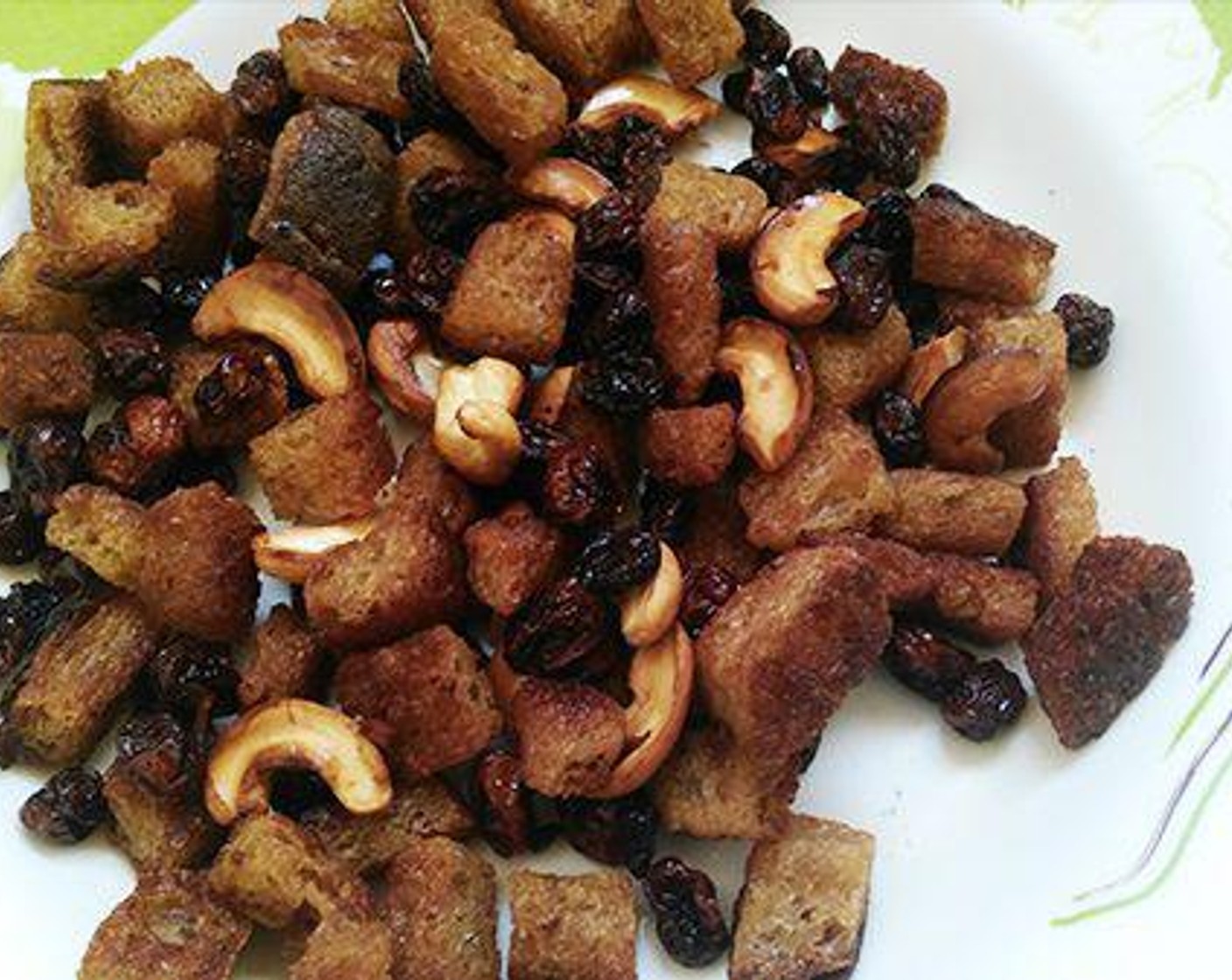 step 1 Wash and soak the Basmati Rice (2 cups) and keep aside for ten minutes. Chop the Bread (1 slice) to small piece. To a pan pour Oil (2 Tbsp) and fry the bread pieces, Cashew Nuts (to taste) and keep aside.