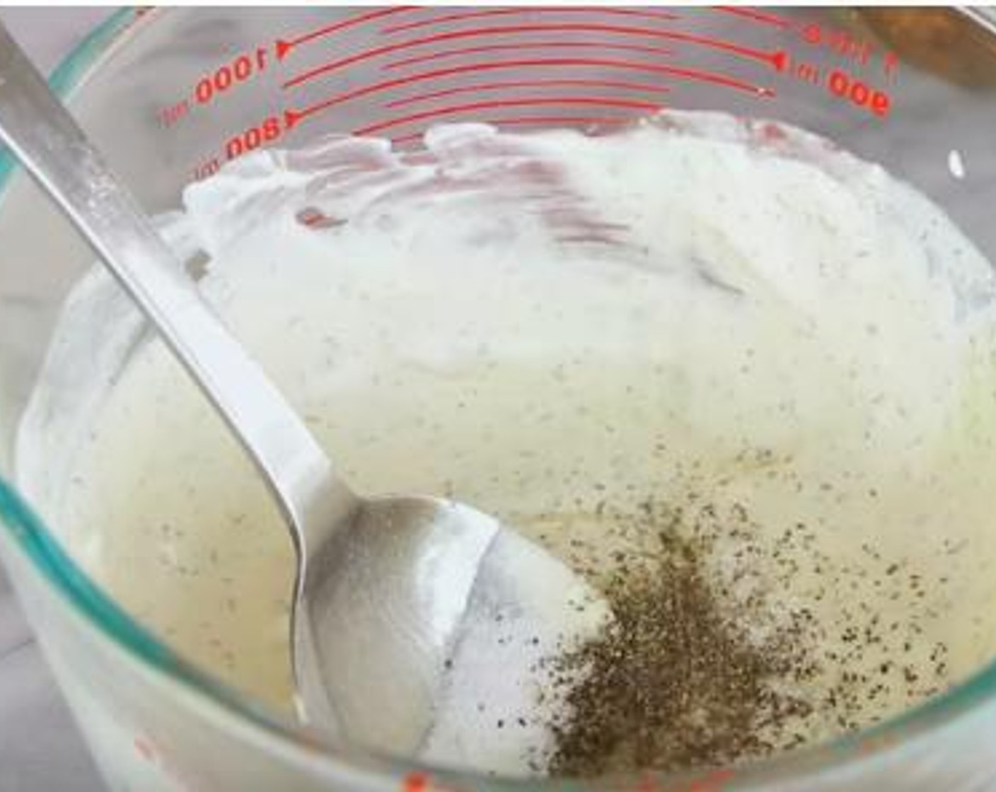 step 4 In a cup, mix together the Sour Cream (4 Tbsp), Mayonnaise (1/2 cup), Dijon Mustard (1 Tbsp), Dried Dill Weed (1/2 tsp), Distilled White Vinegar (1 Tbsp), Simply Organic Garlic Powder (1 tsp), Salt (to taste), and Ground Black Pepper (to taste).