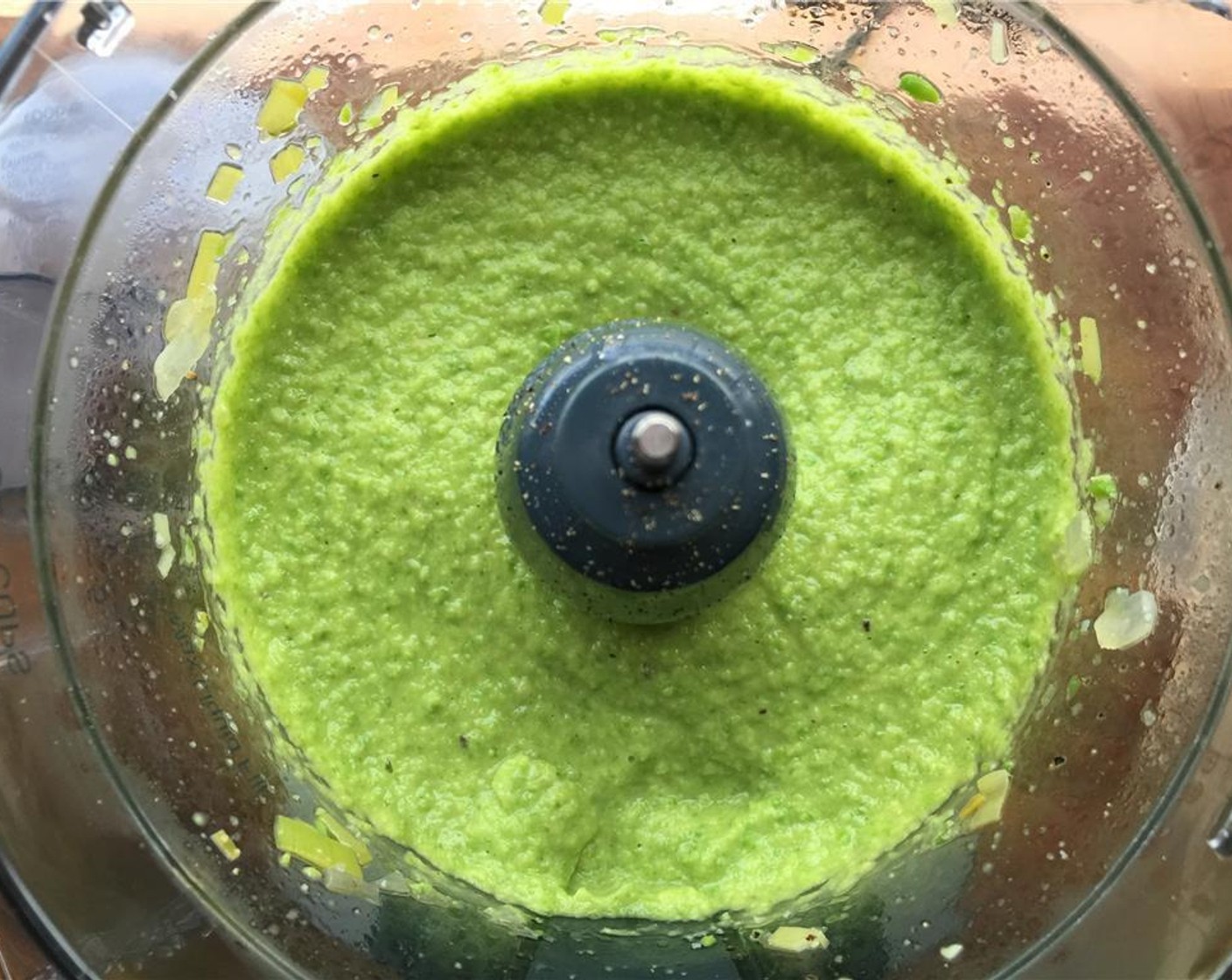 step 8 Using a food processor, purée the pea mixture, adding Kosher Salt (to taste) and Freshly Ground Black Pepper (to taste), and slowly add the saved olive oil a bit at a time until the consistency is that of mashed potatoes.
