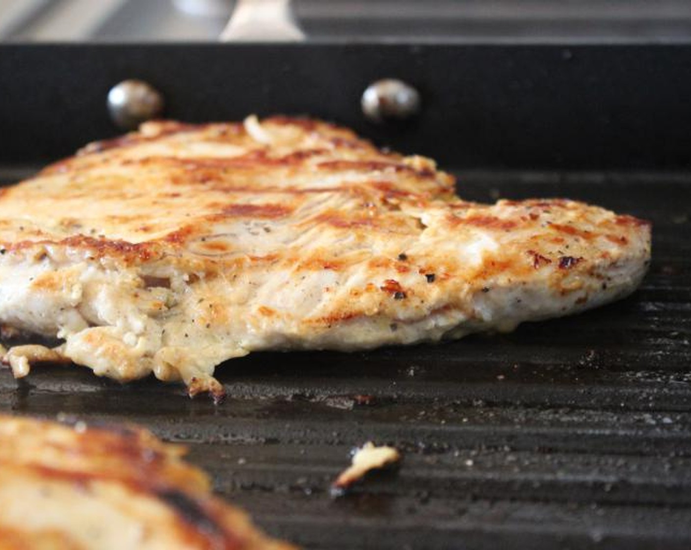 step 5 Heat a grill pan over medium-high heat. Remove the chicken breasts from the bag, pat dry with paper towels, and grill for 3-5 minutes on each side, until there are dark grill marks on each side and the breasts are just cooked through.