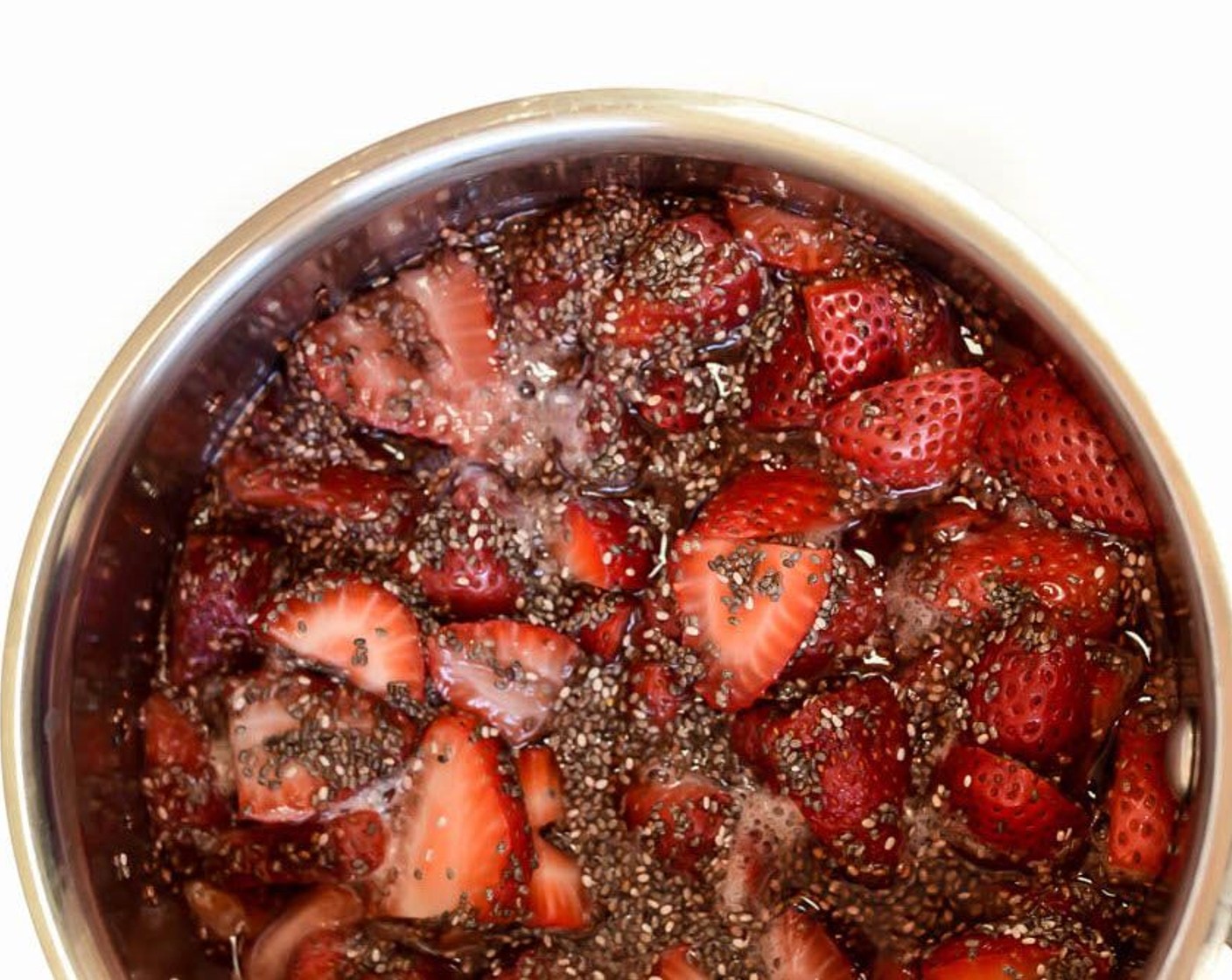 step 2 Combine the Fresh Strawberries (3 cups), Maple Syrup (2 Tbsp) and Water (1/3 cup) in a saucepan over medium heat. Bring to a simmer and allow to simmer until fruit is broken down and forms a jam-like consistency. Remove from heat and stir in Chia Seeds (1 Tbsp). Let cool slightly.