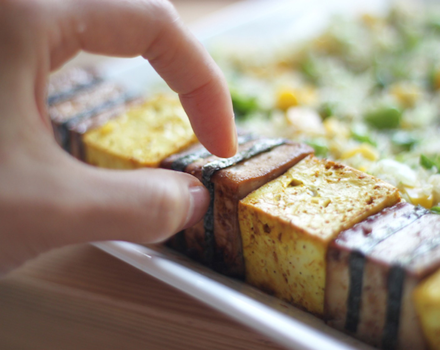 step 13 First, add the blocks. Take the brown tofu and wrap thinly cut dried seaweed around it so it looks like blocks.