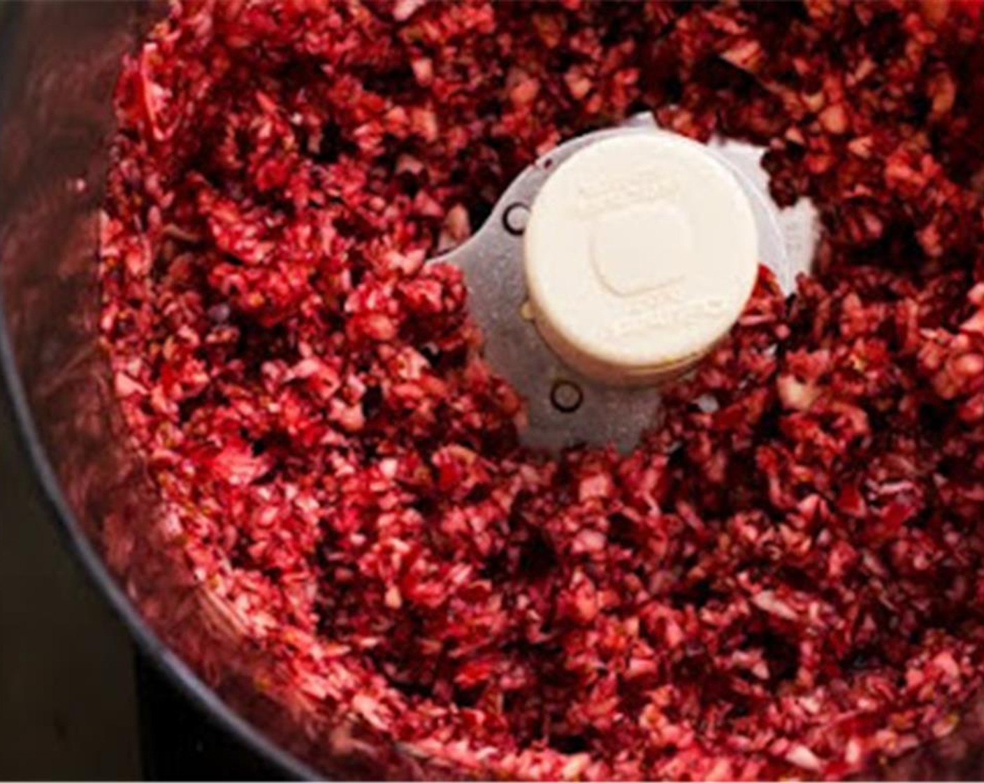 step 2 In the bowl in a food processor, add the Fresh Cranberries (4 1/2 cups) and orange juice. Pulse several times until evenly chopped.