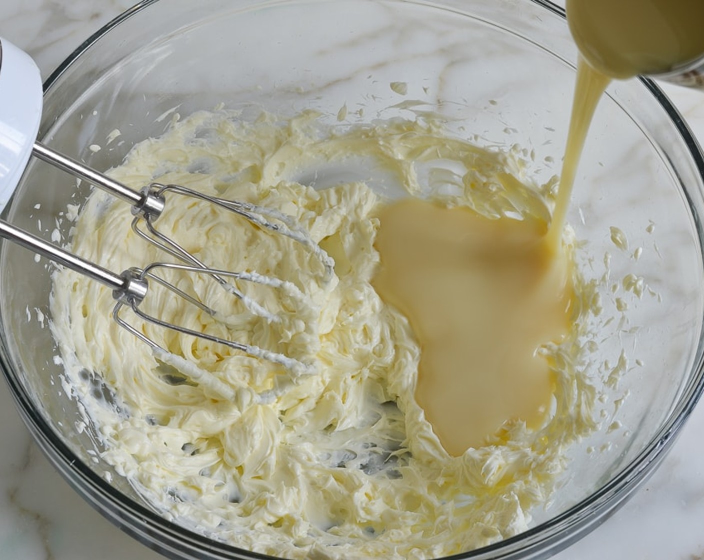 step 7 Add the Sweetened Condensed Milk (1 1/3 cups) and beat until completely smooth, 1 to 2 minutes.