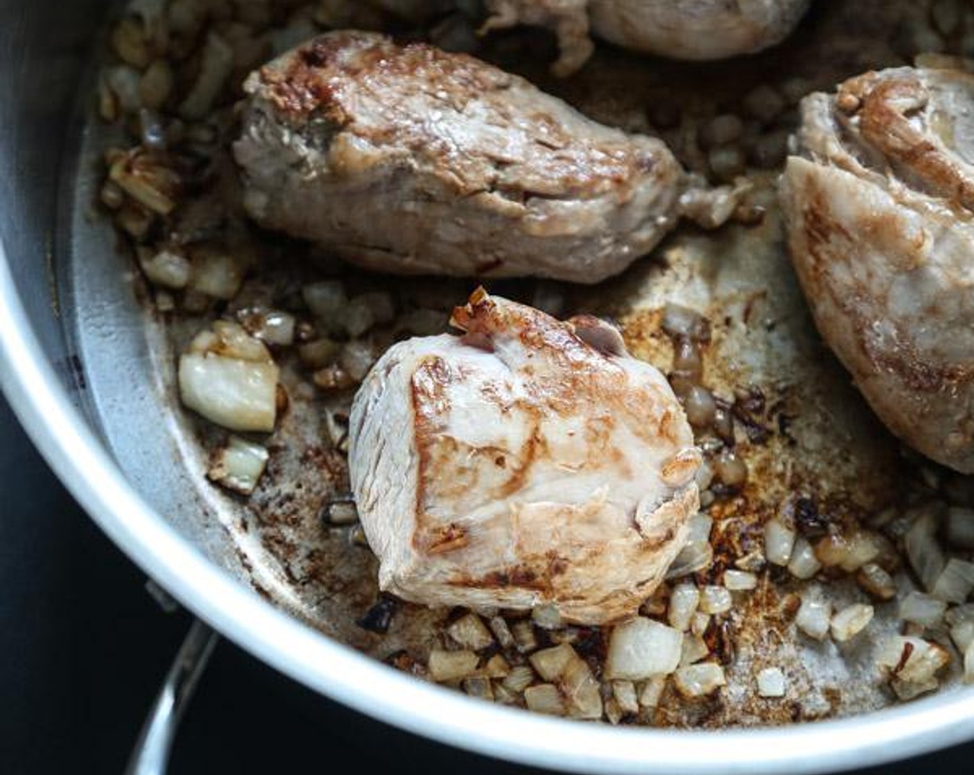 step 2 Add the Yellow Onion (1/2) and Pork Tenderloin (1 lb) and cook, stirring the onions and turning the pork frequently until the meat is browned on all sides, about 5 minutes.