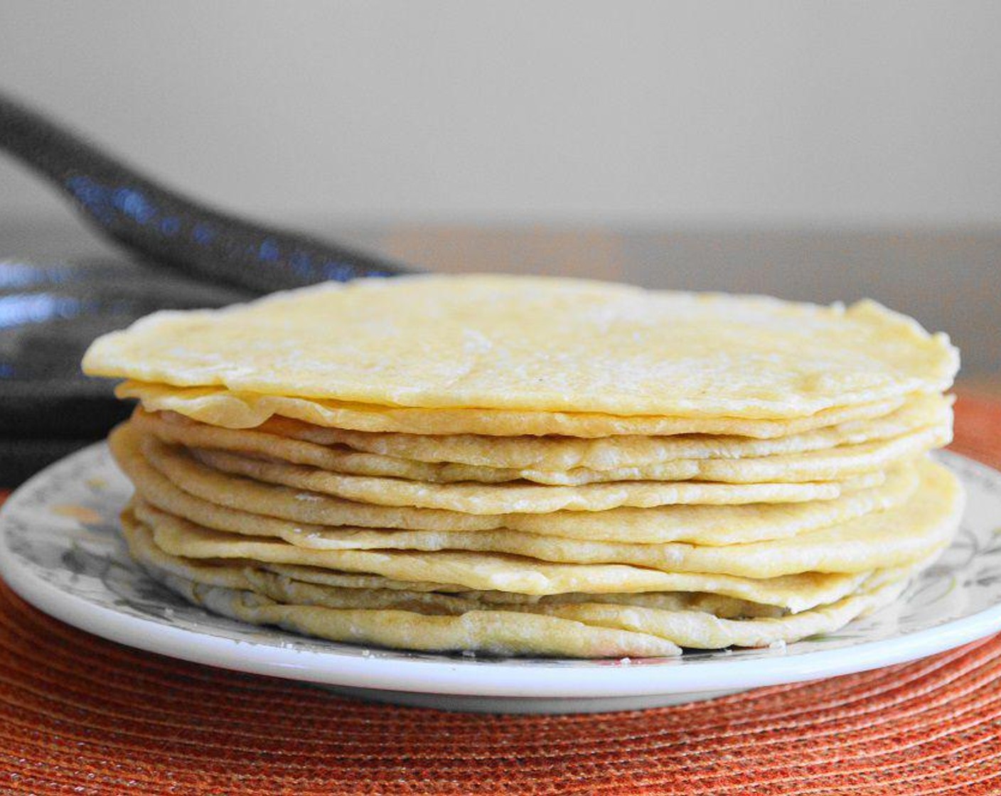 step 6 Preheat an electric griddle to 375 degrees F (190 degrees C) or a non-stick skillet over medium high heat. Cook each formed tortilla for not even a minute on each side, just until they start to get golden with little brown spots. Once they are all cooked, you can seal and refrigerate them for a few days. Enjoy using them for tacos, fajitas, or wrap sandwiches!