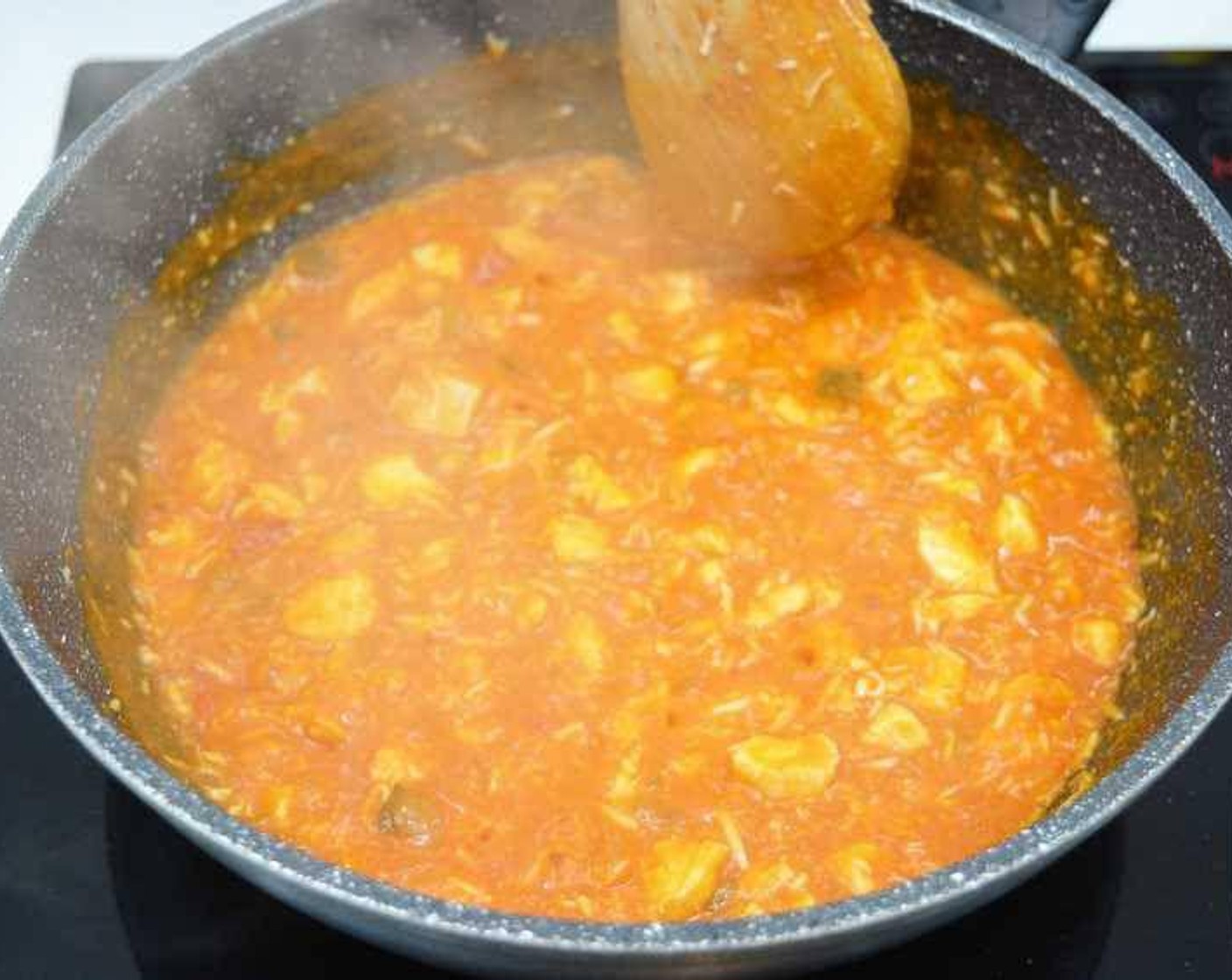 step 6 Season the diced chicken with salt and add to the pan. Add grated egg and Cayenne Pepper (to taste) and mix. Then add the Tomato Sauce (to taste) and after mixing let it reduce to thicken the filling.