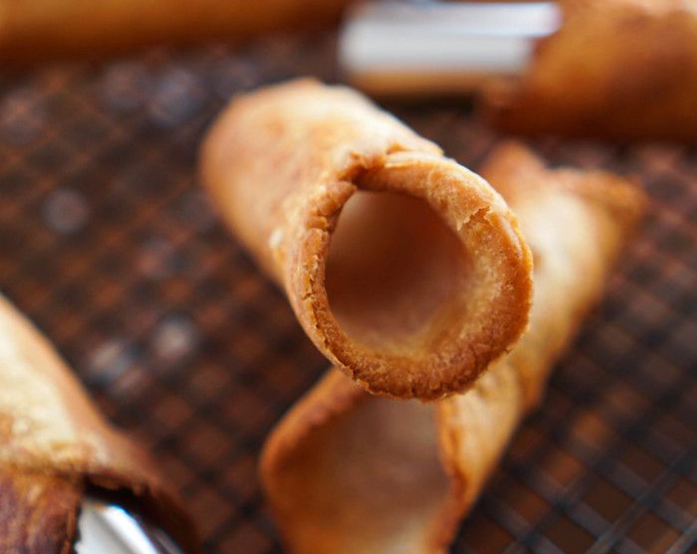 step 8 Fry 1-2 minutes on each side, rotating with a tong, until golden brown. Bubbles will start to form on the shells, which is what you want. Transfer to a paper-towel lined baking sheet and repeat with the remaining dough.