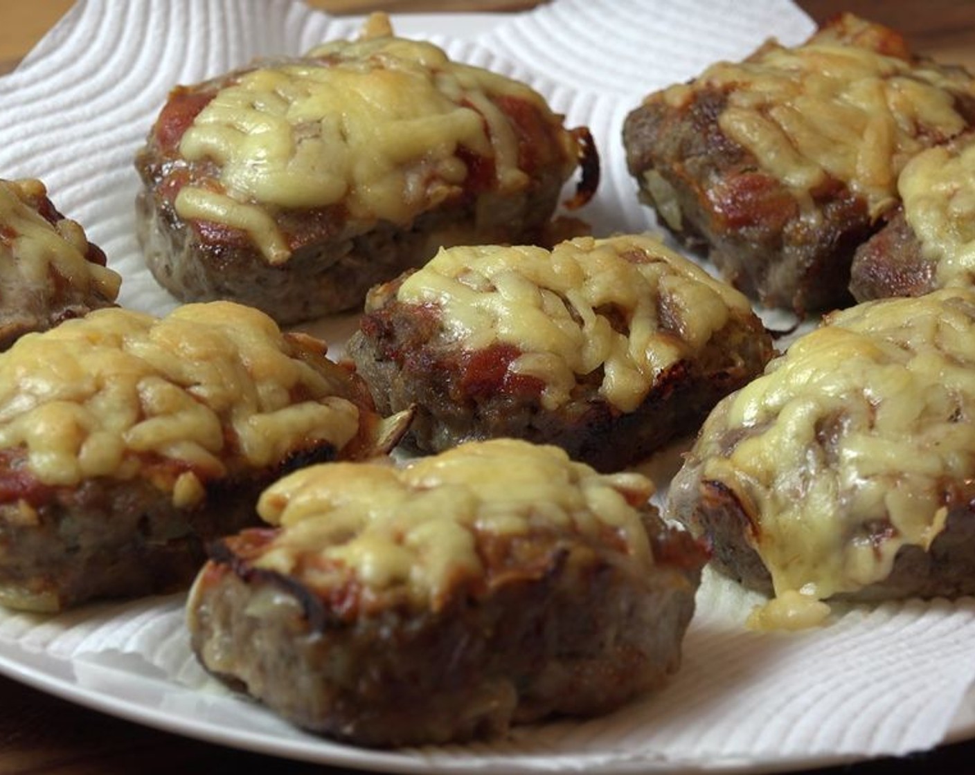 step 8 Transfer meatloaves to a plate lined with paper towels to drain excess grease. Serve with your favorite meatloaf sides!