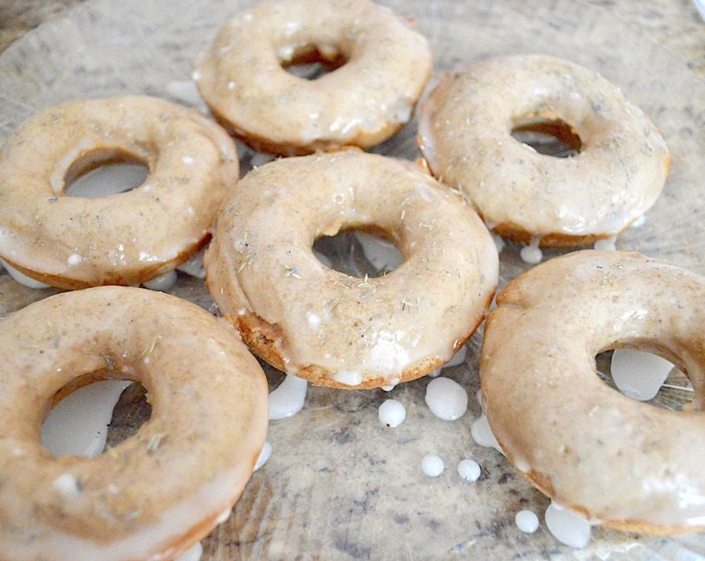 step 8 Dip each donut into the glaze to cover them halfway and place them on a plate. Sprinkle each donut with Ground Lavender (to taste) on top before the glaze dries and serve! They will keep for a couple of days in the refrigerator in an airtight container.