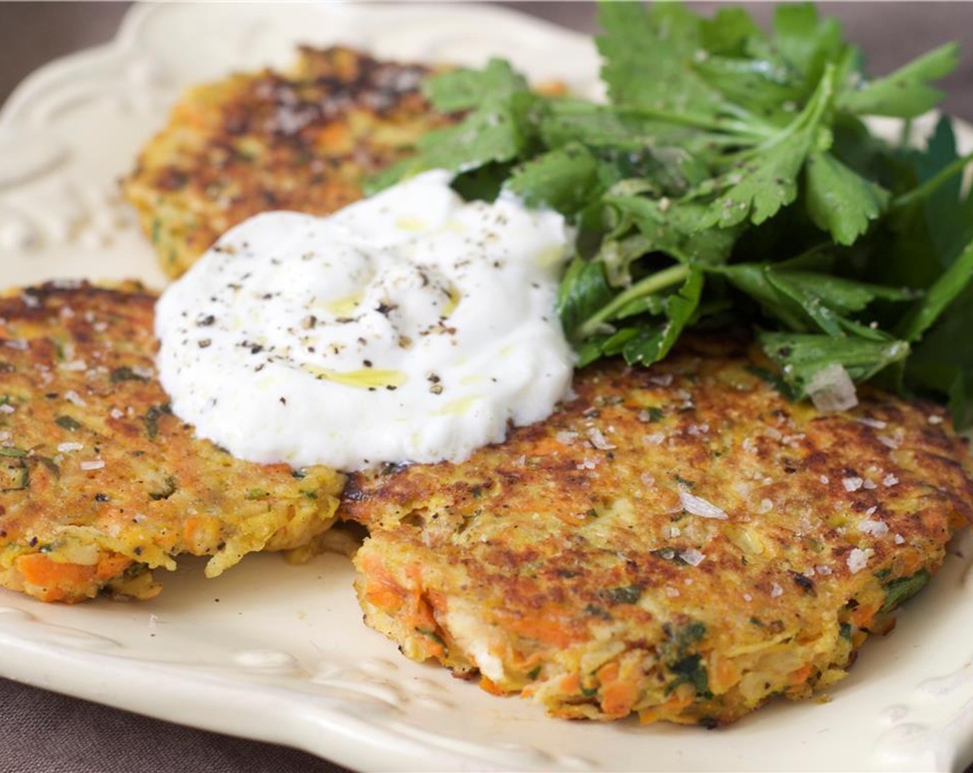 step 9 Serve pancakes hot with a dollop of yogurt sauce and a helping of herb salad. Enjoy!