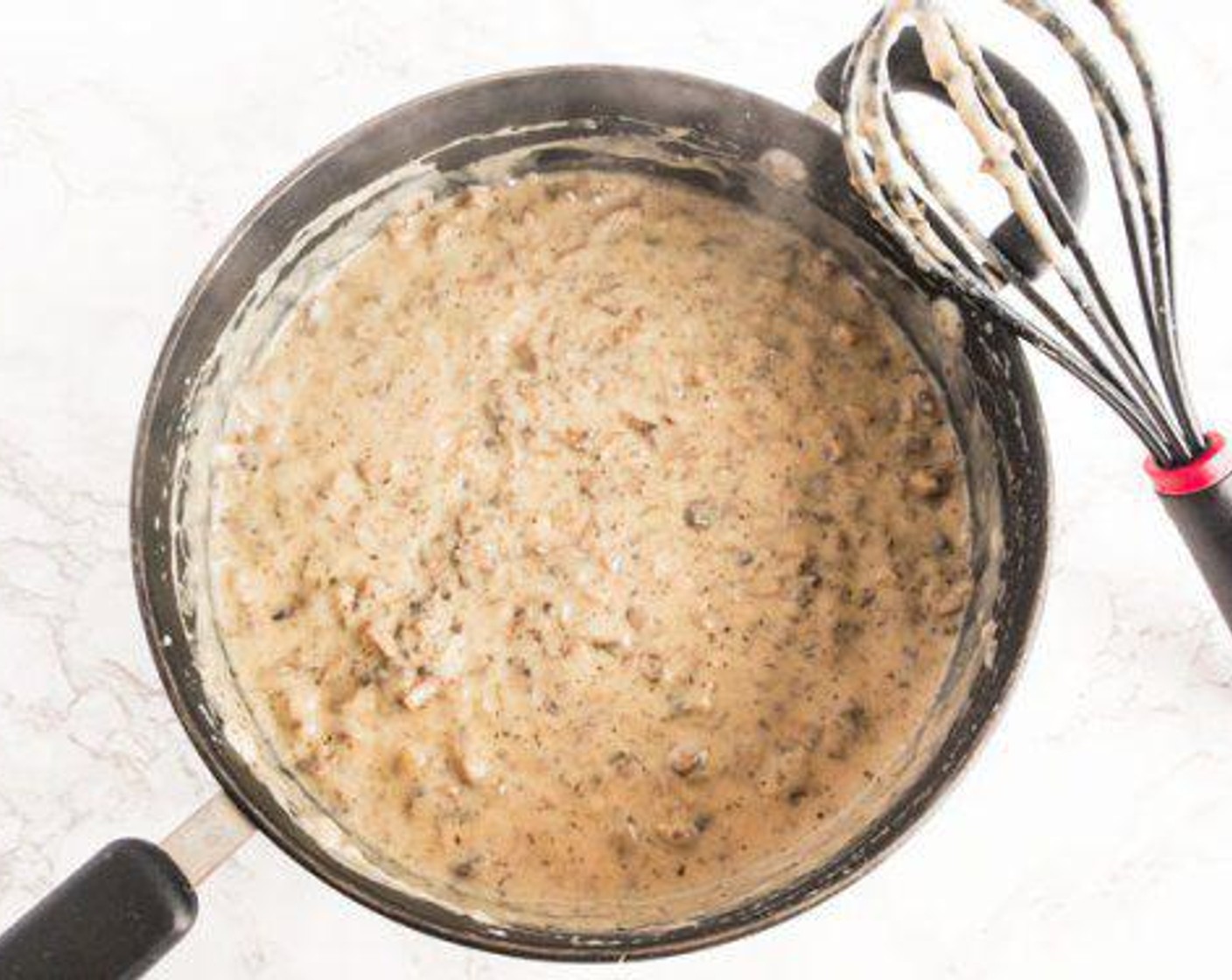 step 2 In a large pan or extra large 12-inch oven-safe skillet, whisk Almond Milk (3 cups), All-Purpose Flour (1/2 cup), and Buttery Spread (1/4 cup) on medium-high until smooth.