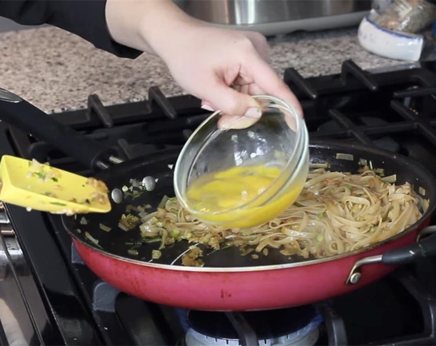 step 16 Beat Farmhouse Eggs® Large Brown Eggs (2) lightly in a bowl and add to the empty side of the pan. Let the eggs set, as if making a thin omelet. Once set, move the noodles into the top of the egg.