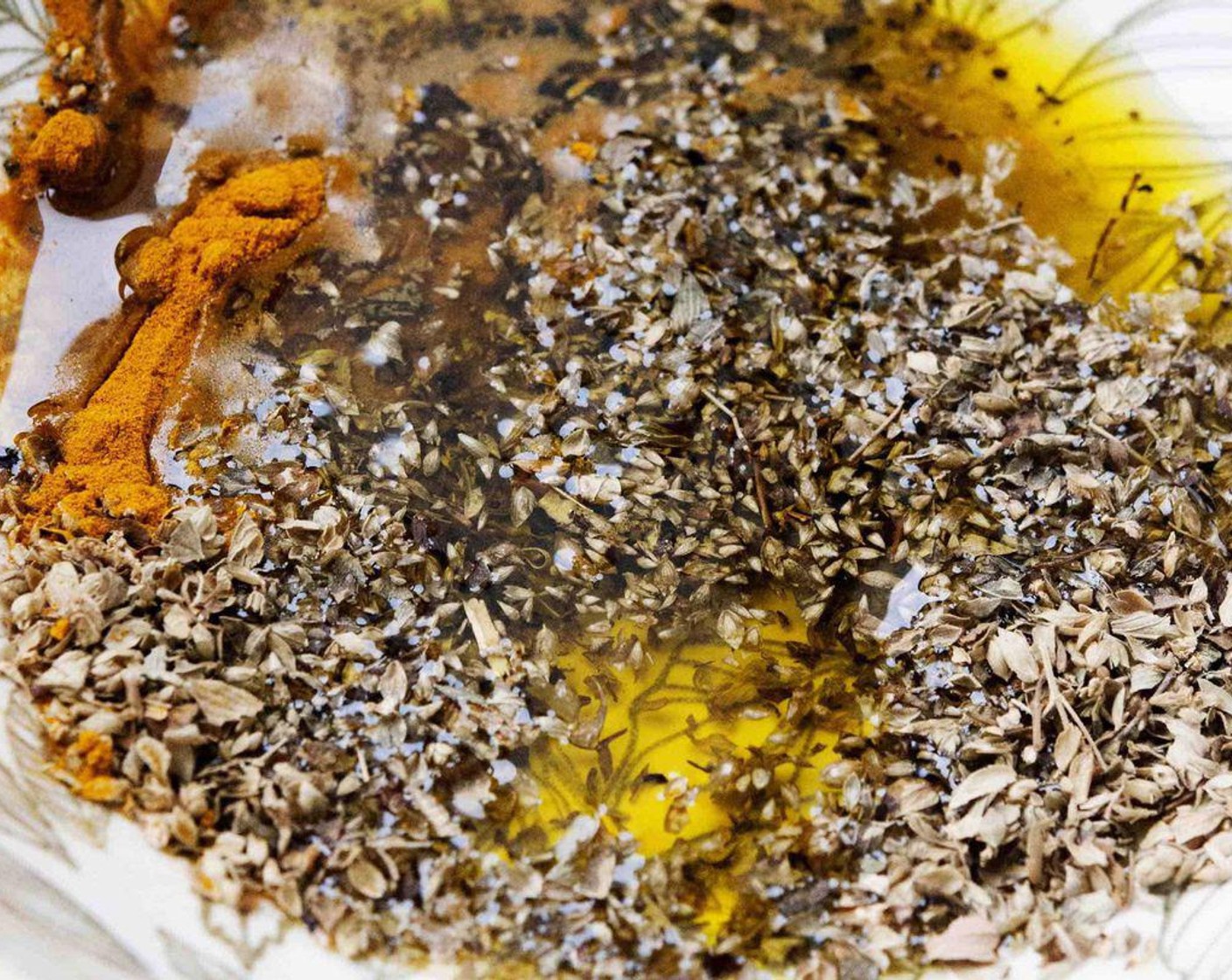 step 2 In a bowl, combine Extra-Virgin Olive Oil (1/3 cup), Dried Oregano (2 Tbsp), Ground Turmeric (1 Tbsp), Salt (to taste), and Ground Black Pepper (to taste). Stir until ingredients are all well mixed.