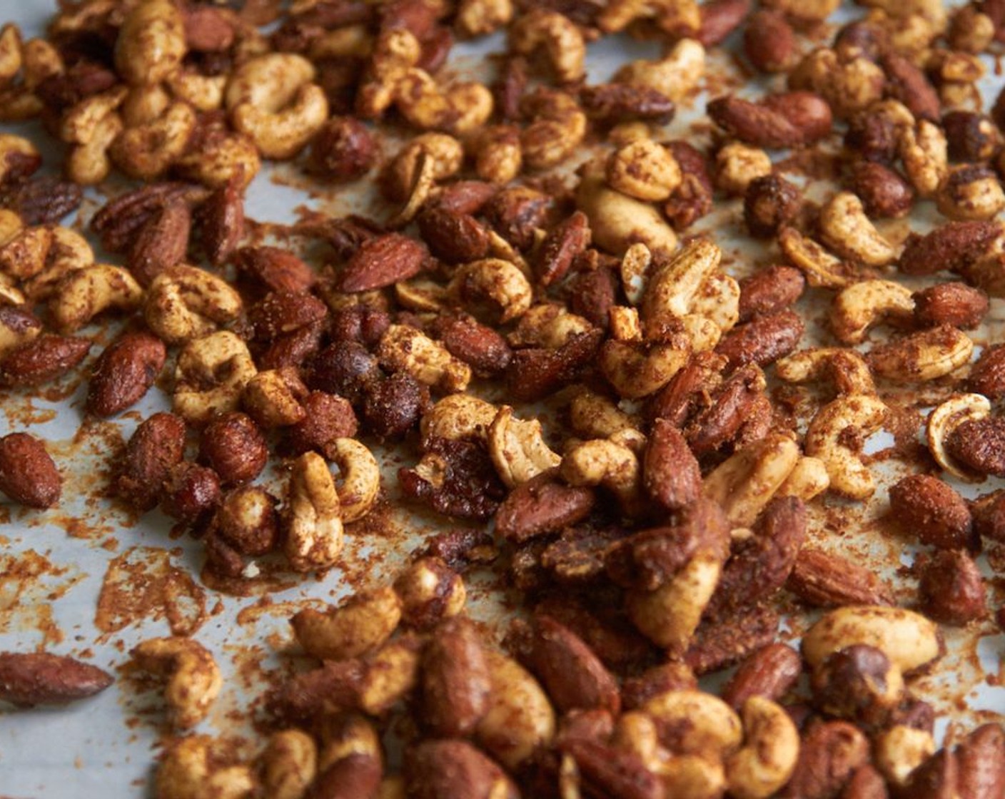 step 4 Line a baking sheet with parchment paper. Spread nuts in a single layer on the parchment.