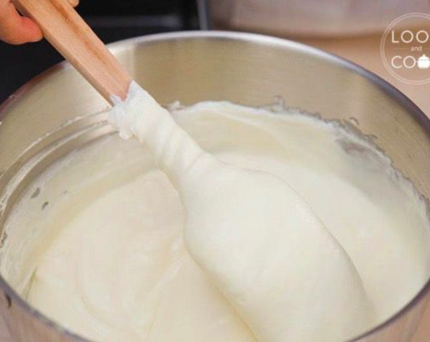 step 7 Add the whipped cream mixture to the egg and mascarpone cheese mixture. Fold in gently.