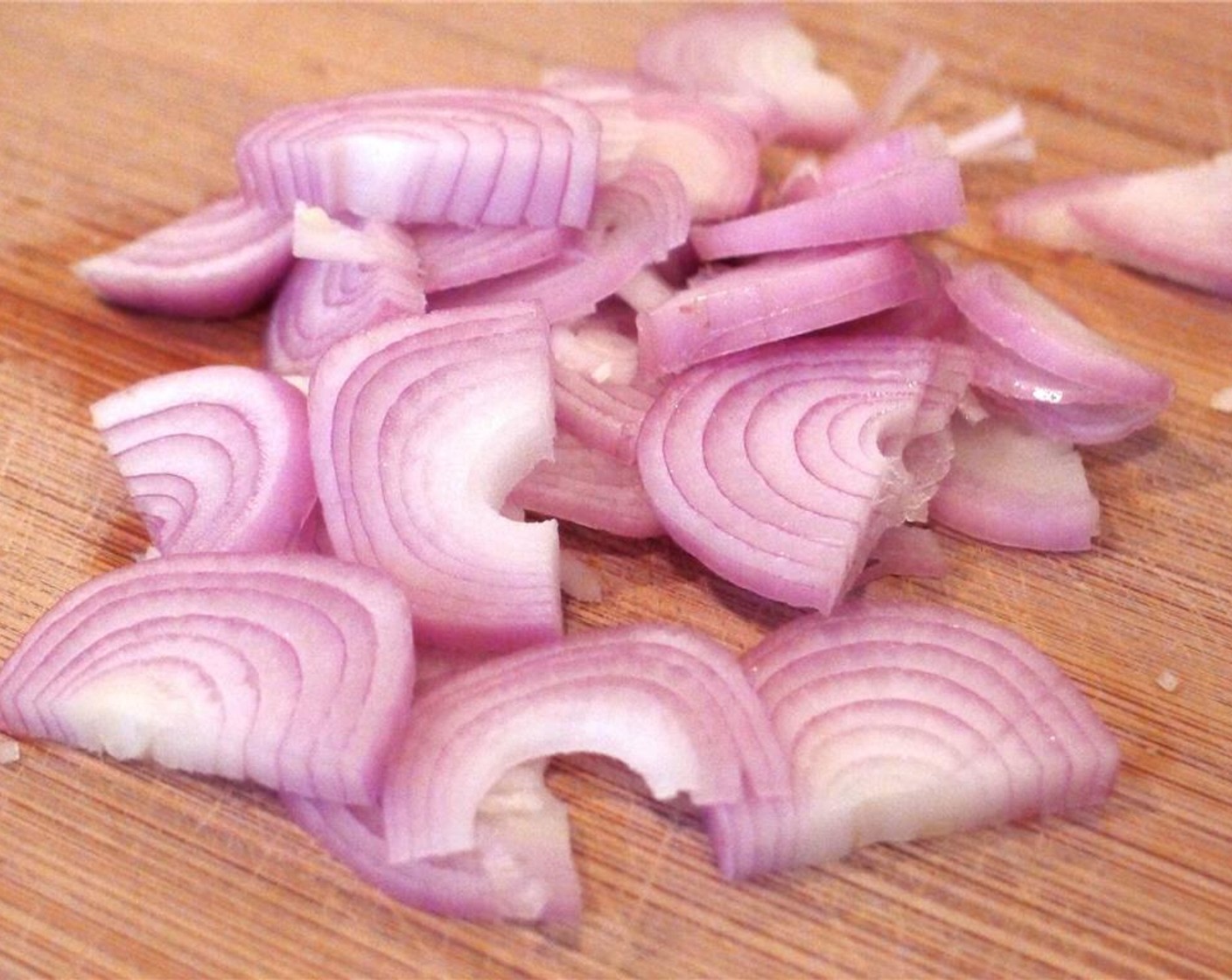 step 4 Finely slice the Shallot (1) into half moons.