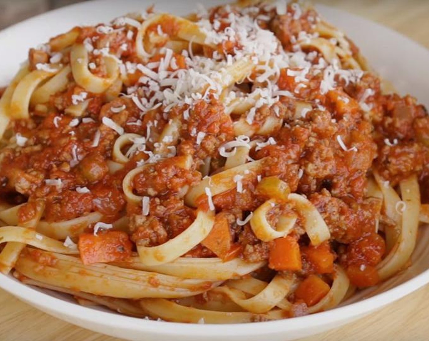 step 5 To serve, place pasta in shallow bowls and spoon the rest of the sauce over the pasta and grate Parmigiano-Reggiano (to taste) on top.