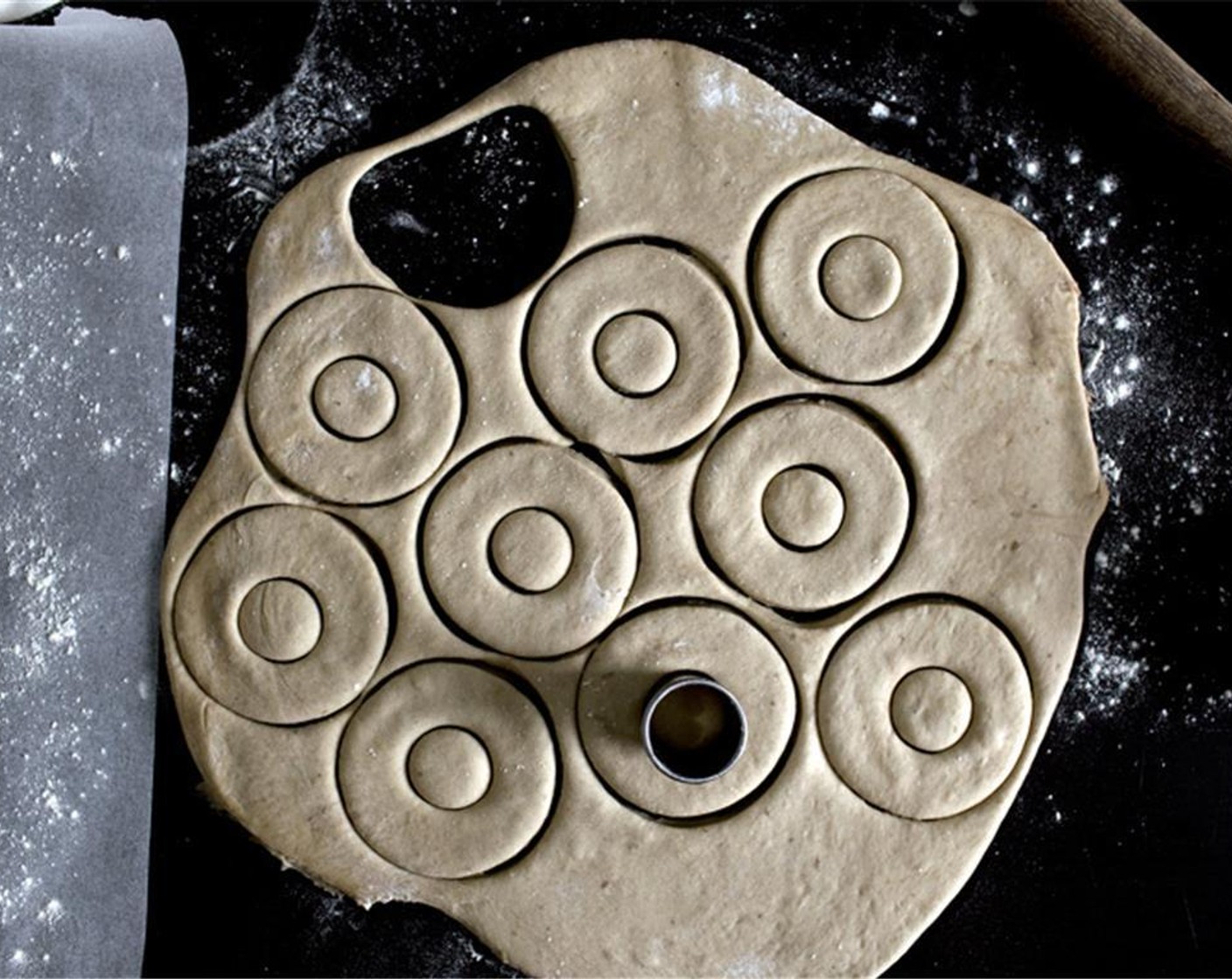 step 7 Transfer the dough onto a floured surface, and roll out into 1/3-inch (1 cm) thickness. Cut out as many donuts as you can, then gather the scraps and cut again. You should have about 12~14 donuts and donut-holes.