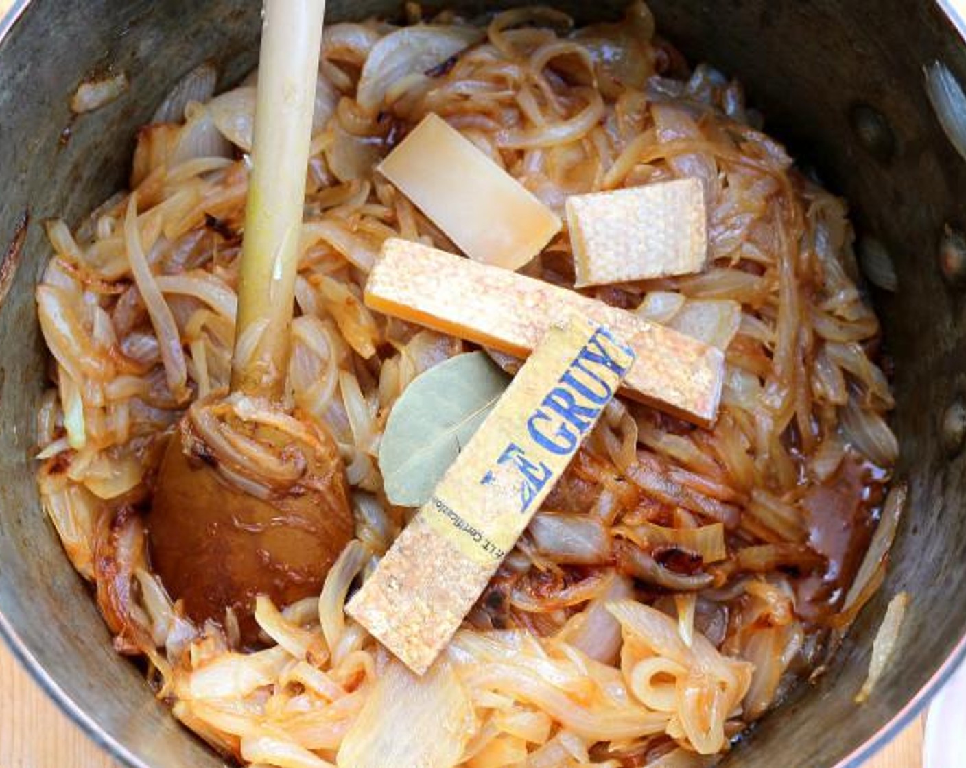 step 4 Add the rinds of the Gruyère cheese if available.