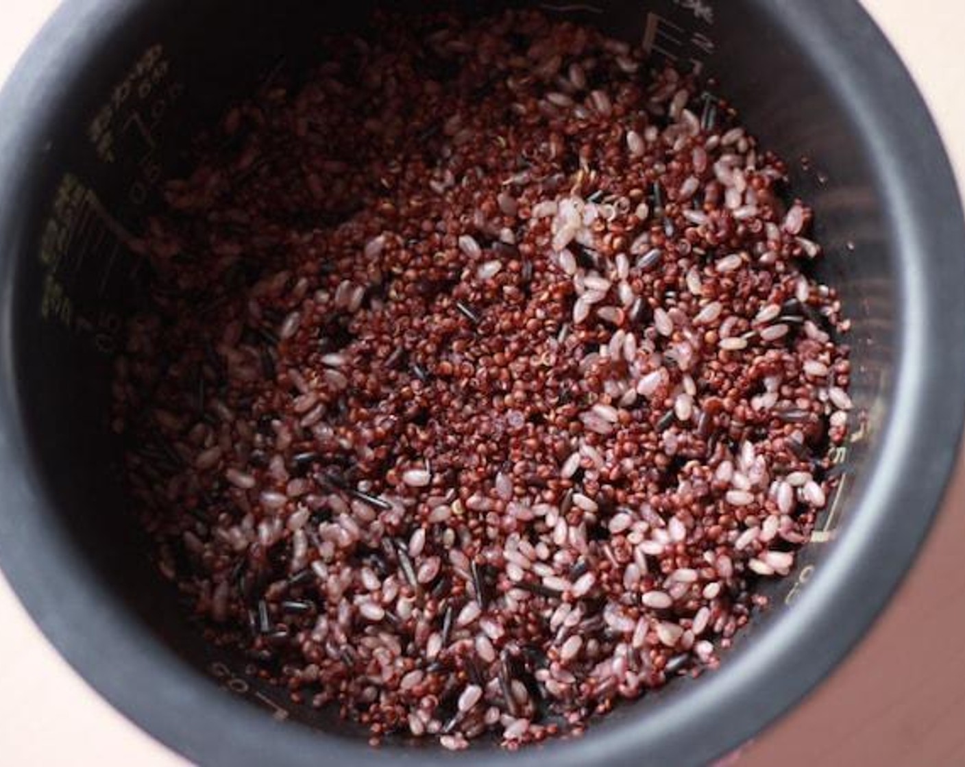 step 6 When rice is done, start flavoring. Mix the cooked rice with the rest of the ingredients. Add Soy Sauce (3 Tbsp), Salt (1 pinch), Ground Black Pepper (1 tsp), Ground Cumin (1 Tbsp), Ground Coriander (1 tsp), and Cayenne Pepper (1 tsp) in the bowl and mix well!