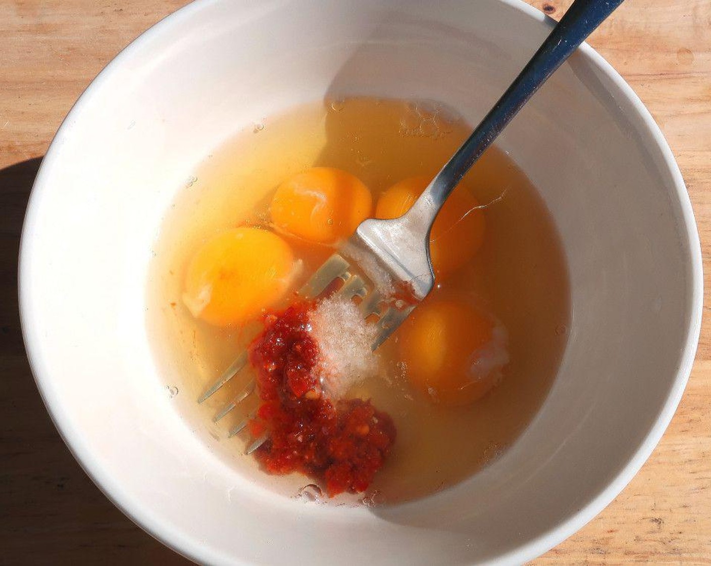 step 1 Season Eggland's Best Classic Eggs (4) with Kosher Salt (to taste) and Chili Paste (to taste), whisk.