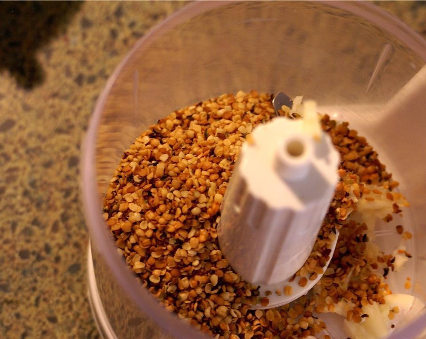 step 2 Spread Hemp Hearts (1/3 cup) out on on a parchment lined pan and bake for 5-7 minutes, or until the seeds are golden brown.  Watch closely because they burn fast! Then add to the food processor.