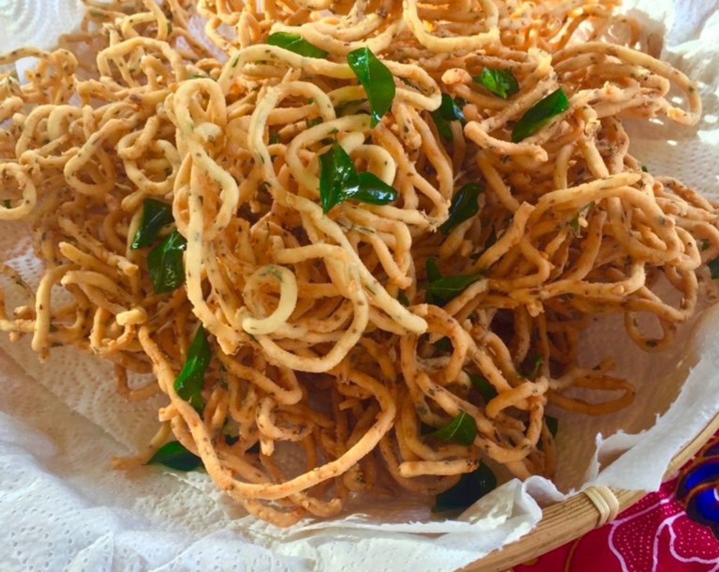 step 17 Remove the fried murukku with a strainer and drain them on some paper towels. Repeat the same for the rest of the murukku dough.