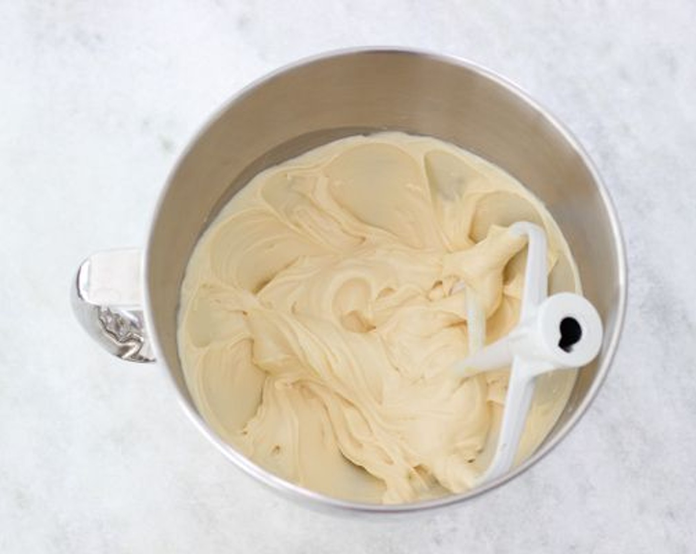 step 8 Meanwhile, make the frosting. With a paddle attachment on a standing mixer or using a hand mixer, mix the Philadelphia Original Soft Cheese (1 cup) until it has a creamy and even consistency.
