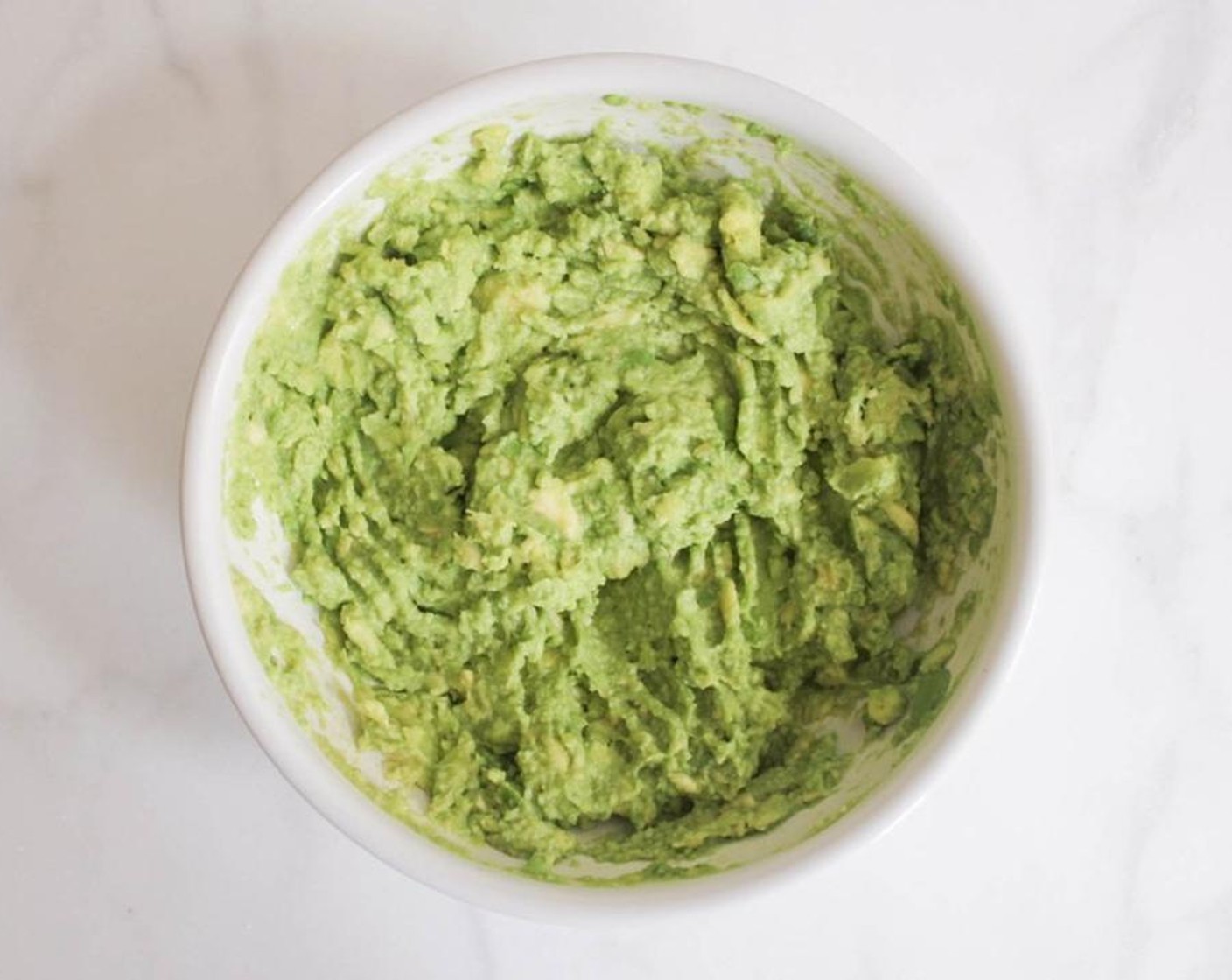 step 2 Mash the avocados with a fork until relatively smooth. Briefly set aside.