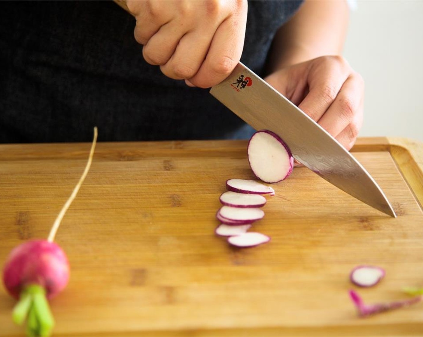 step 8 Slice Radish (1 bunch) as thinly as possible into round circles, and place in the bowl with the vinegar and sugar blend. Toss radishes to evenly coat and set aside to pickle.