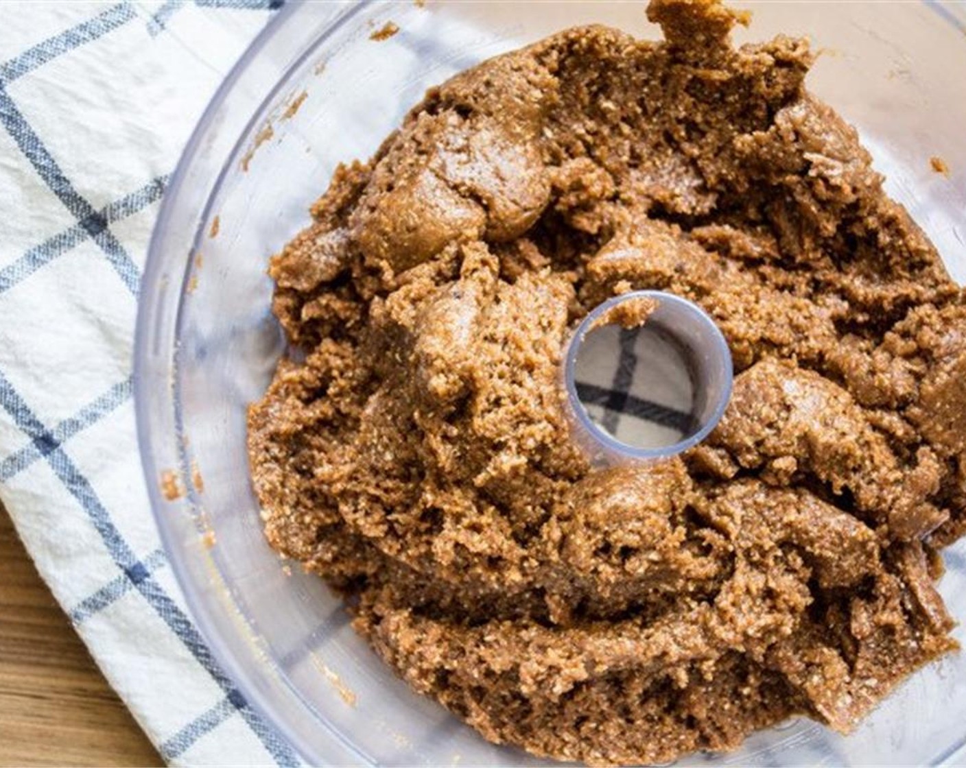 step 4 Add the blended oat flour, Baking Soda (3/4 tsp) and Salt (1/4 tsp) to the peanut butter mixture and process until all ingredients are well combined. Add Almond Milk (1/3 cup) and mix again.