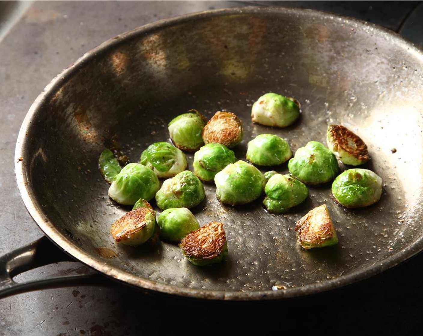 step 25 Cook until there is significant carmelization on cut side, then flip sprouts and color lightly on other side.