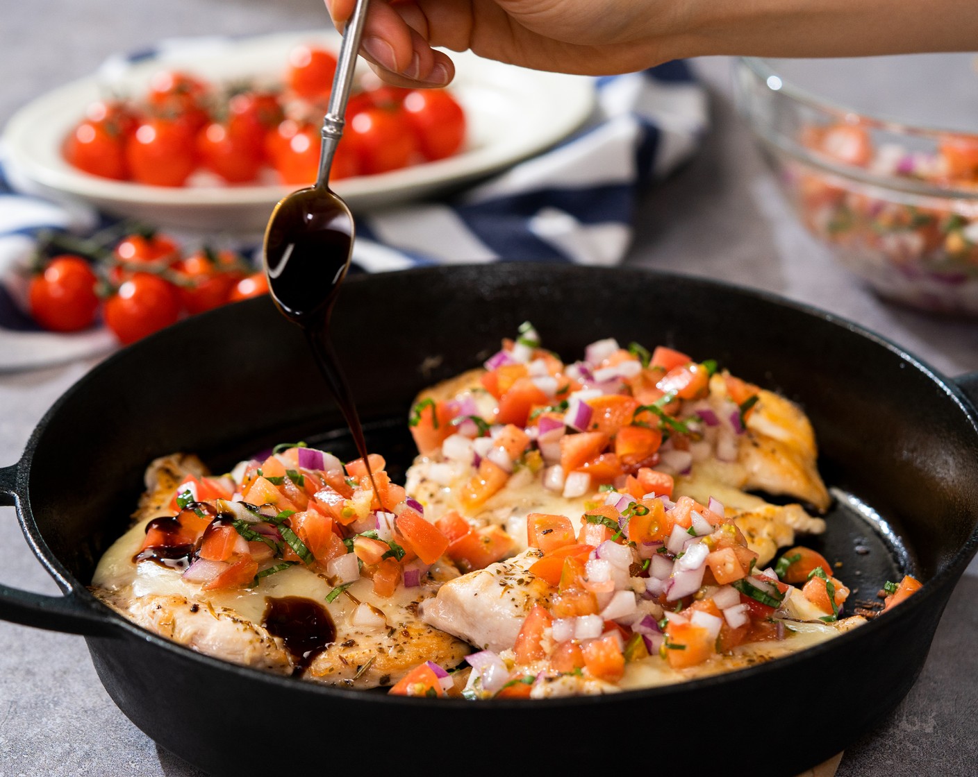 step 5 Top each chicken breast with bruschetta and drizzle with Balsamic Glaze (1/4 cup). Garnish with whole basil leaves and serve with Baguette (1).