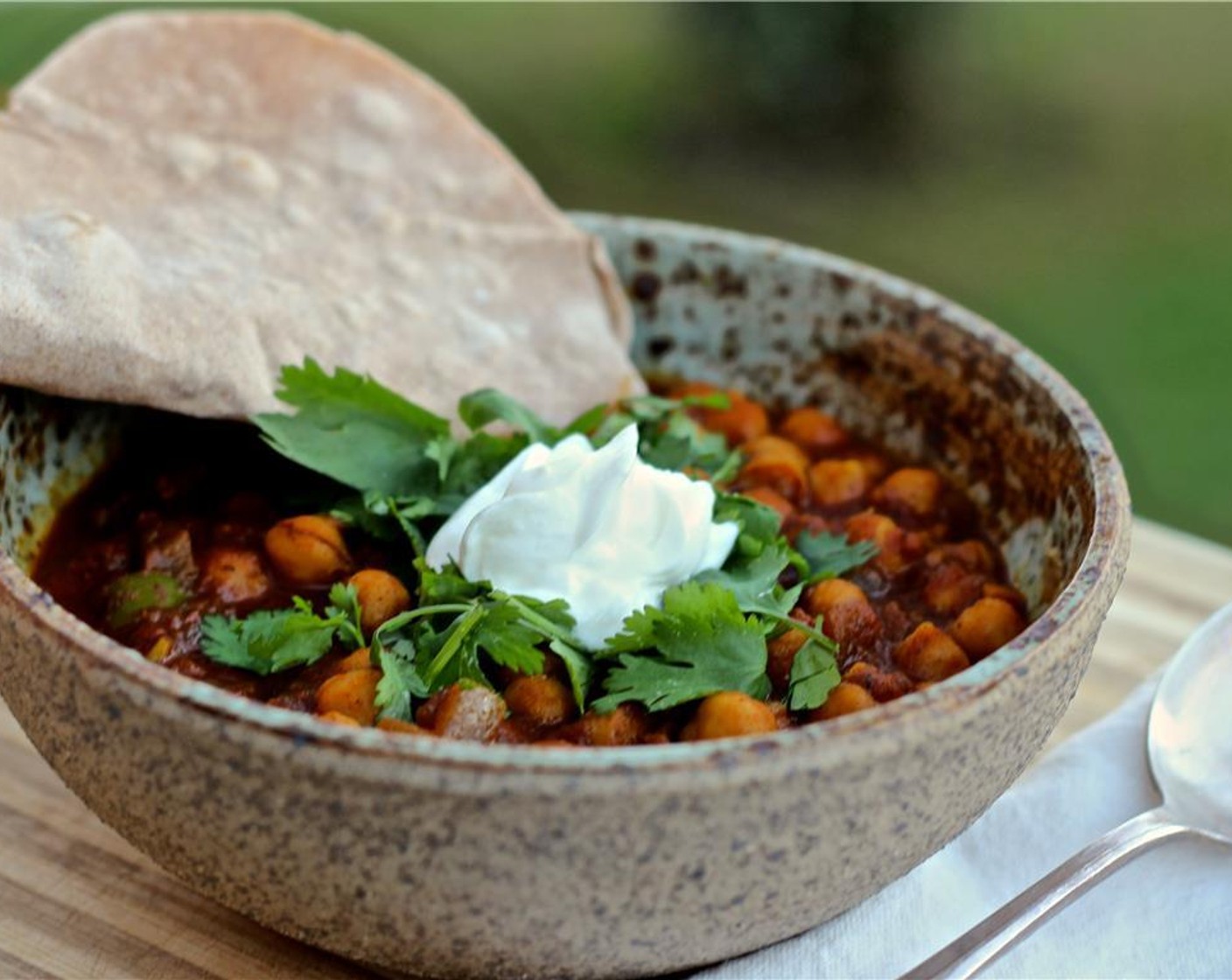 step 13 Garnish the chana masala with Yogurt (to taste) and fresh Fresh Cilantro (to taste) and serve with the roti. Enjoy!